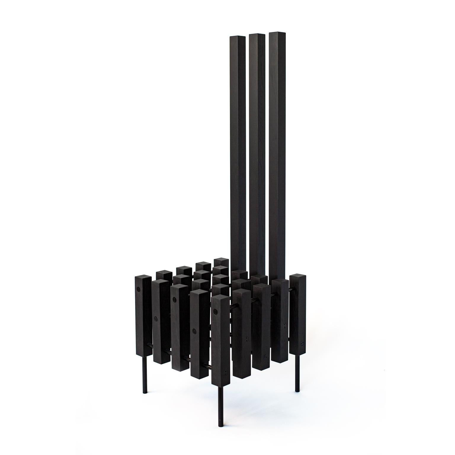 The Object Chair Matrix is  wood  hand made chair  in geometrical form, with  black metal details.
It is a form of an experience the comer makes individually.
Is it a chair? Is it a sculpture? Is it an art object? Or is it maybe the  Chair Matrix
