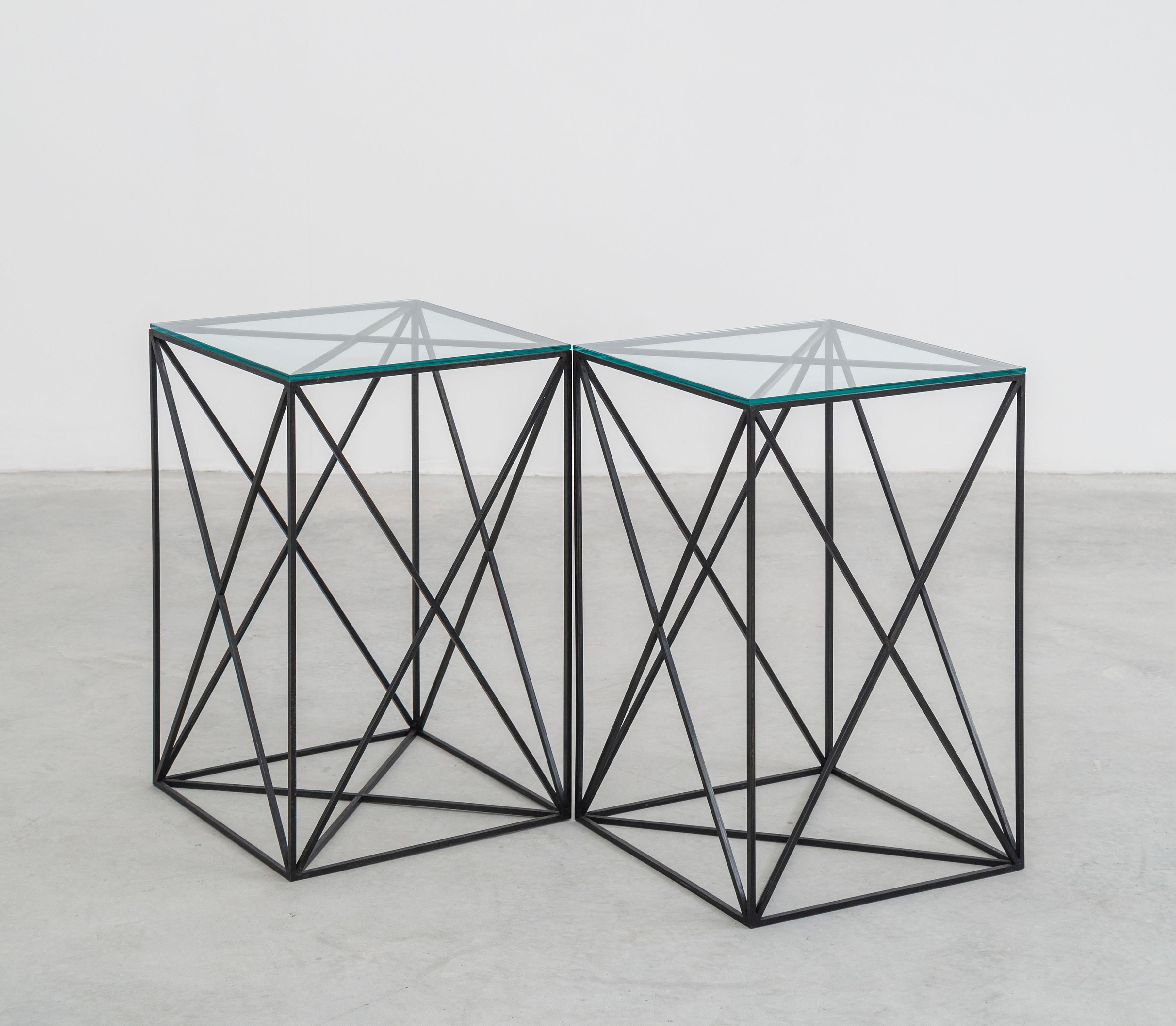 Black steel and glass table fashioned after Fehren's signature X-aesthetic. 

 