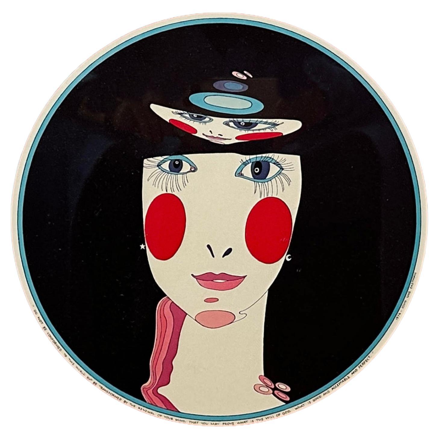 This lithograph, created by the artist John Luke Eastman combines vintage beauty inspirations with a surreal atmosphere. Its square frame and vibrant red backdrop draw our attention towards the center. Within this space, a stylized face, reminiscent