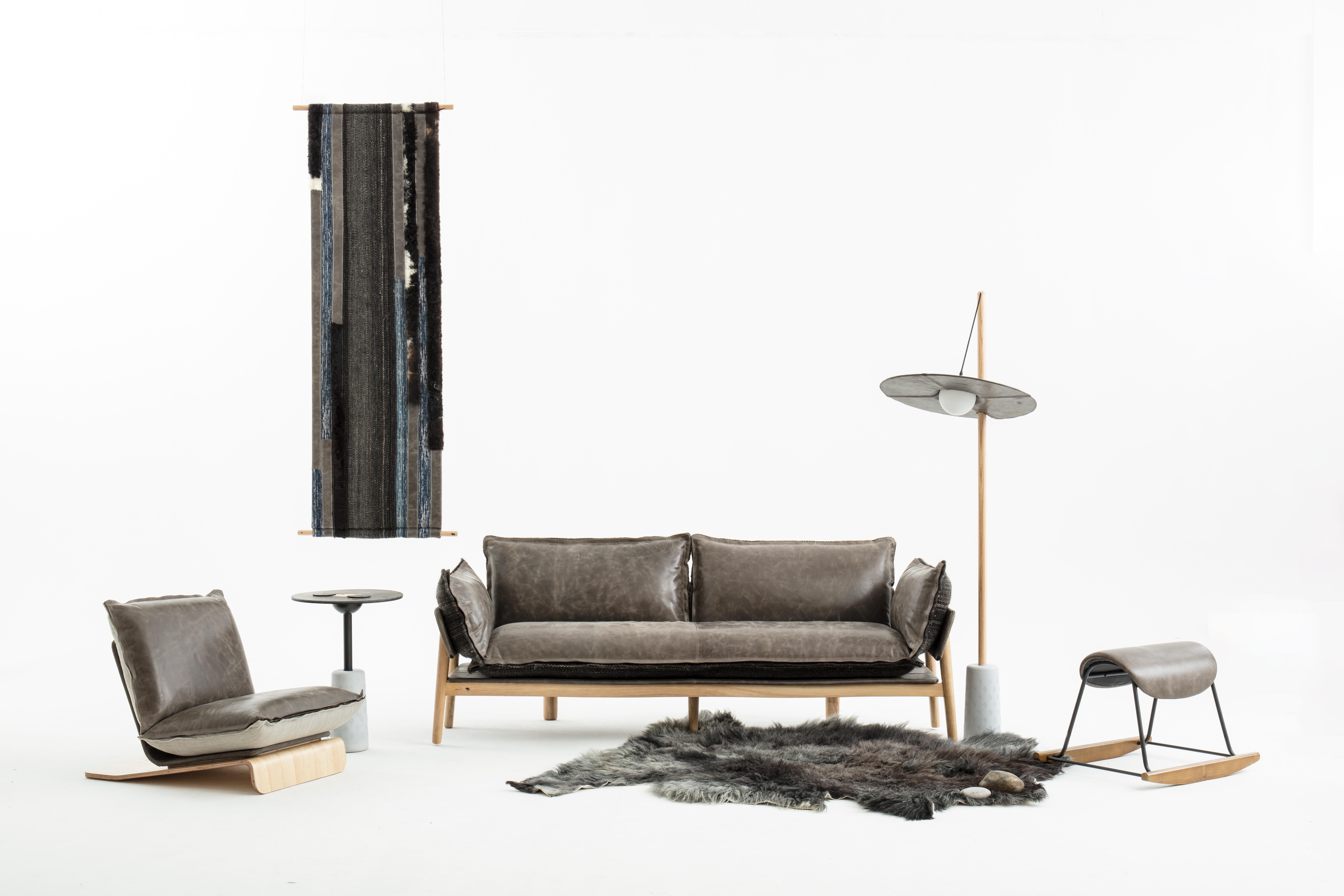 Introducing the NOMAD SKIN SOFA, a stunning piece of furniture that redefines comfort and style. This extraordinary designer sofa draws inspiration from Tibetan craftsmanship, showcasing the beauty of yak leather and handwoven wool. Designed for