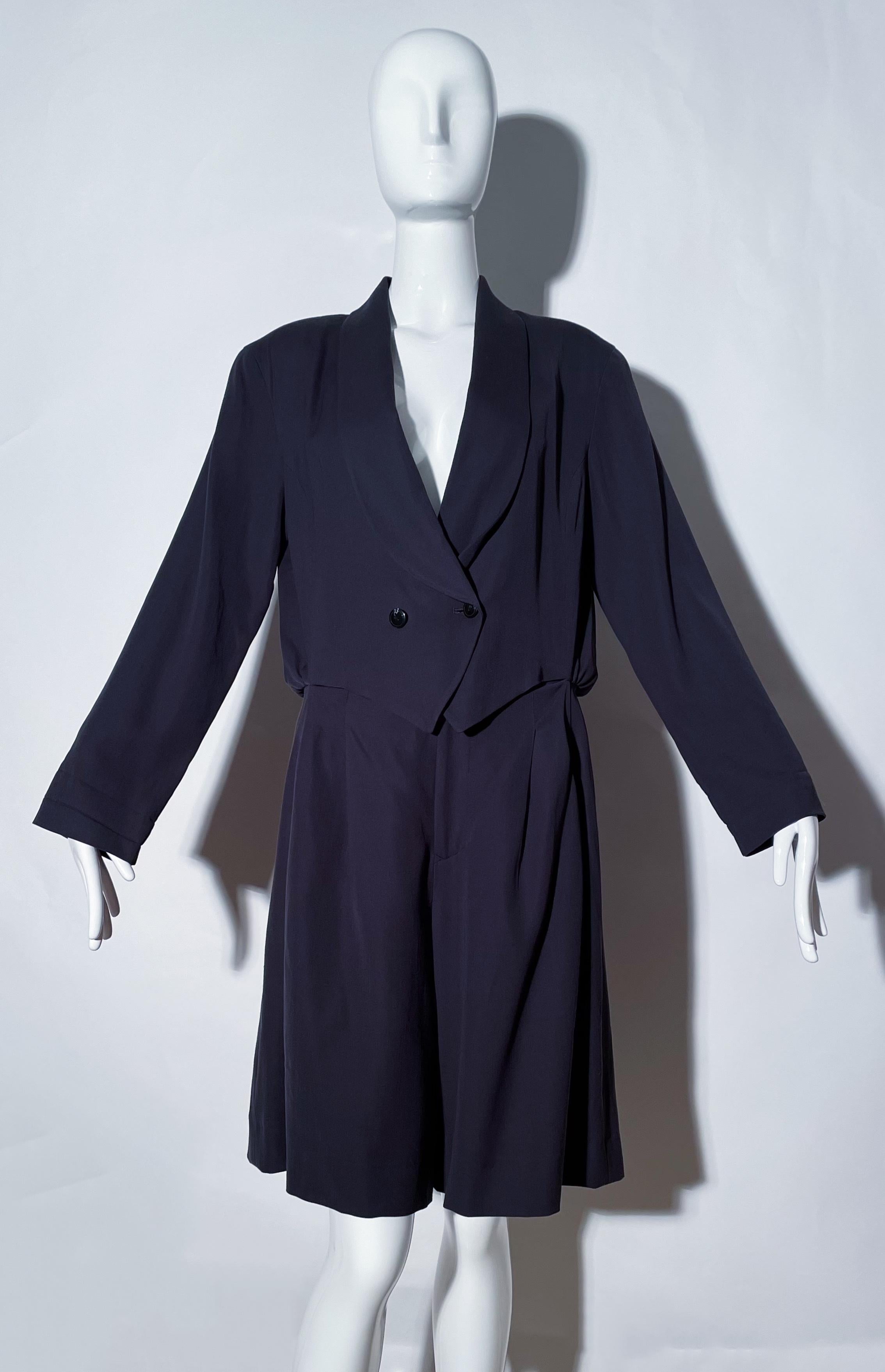 Black romper. Blazer style. Collared. Shoulder pads. Front button closures. Elastic waistband. Front pockets. Lined. Made in Japan. 
*Condition: excellent vintage condition. No visible flaws.

Measurements Taken Laying Flat (inches)—
Shoulder to