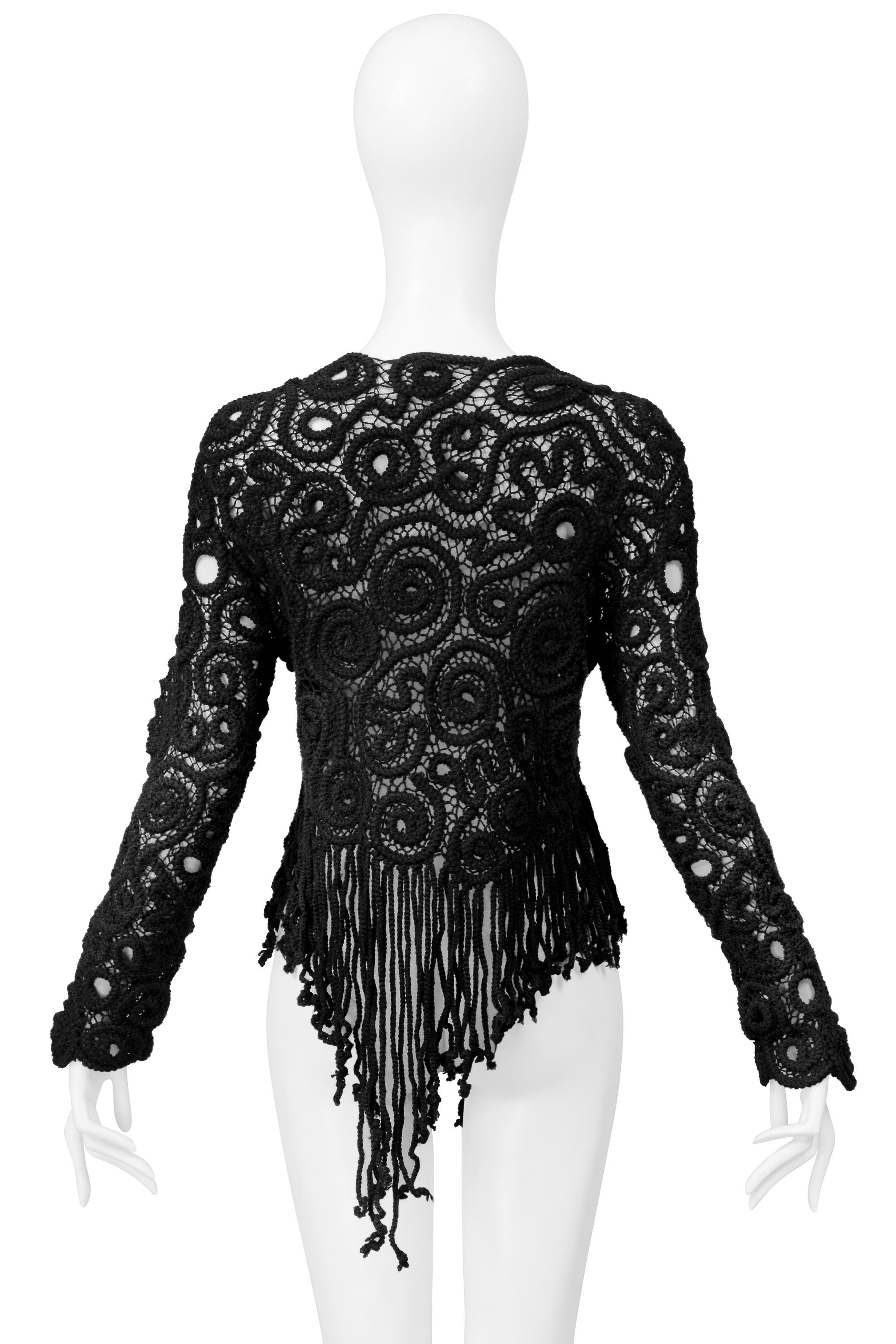 Resurrection is excited to offer a vintage Matsuda black sweater featuring fancy knitted detailed swirls, long sleeves, a boat neck, and an asymmetrical rope fringe hem. Made in Japan. 
* Matsuda 
* Size: Medium
* Fabric: Wool
* Excellent Vintage