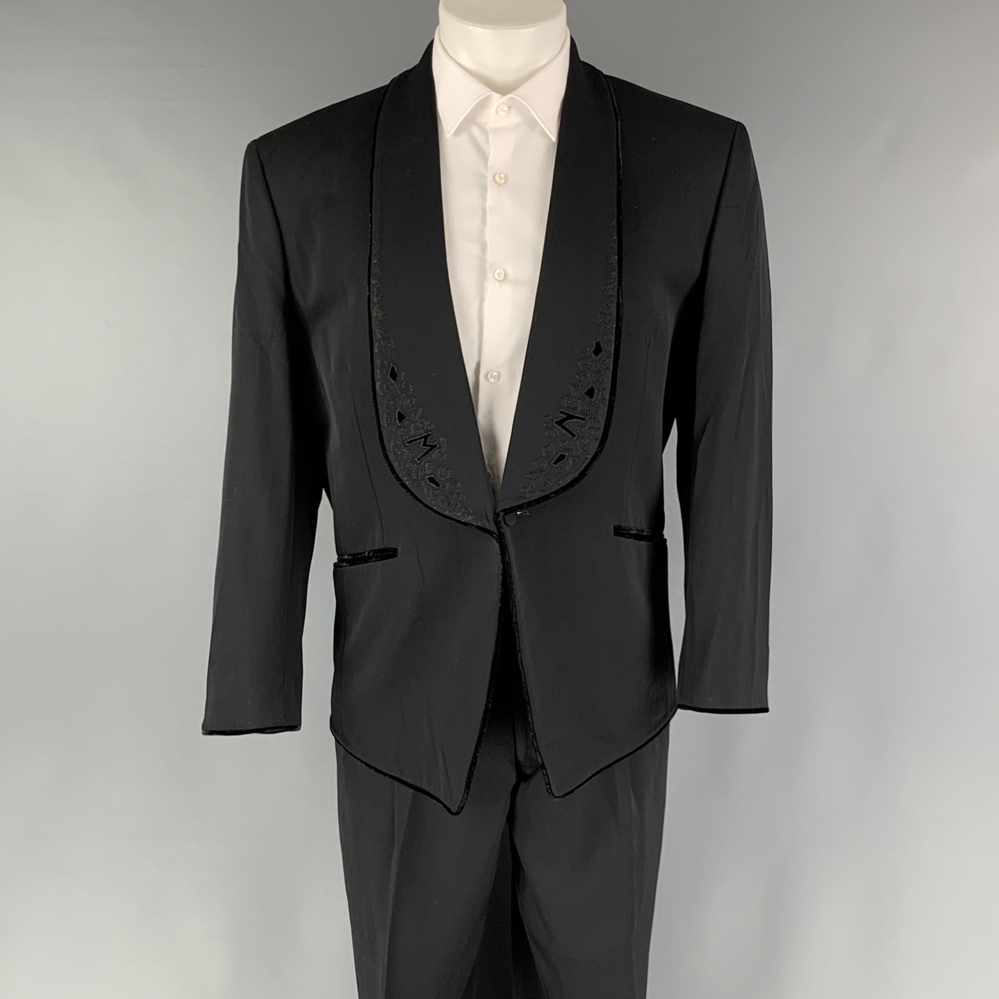 MATSUDA VINTAGE suit comes in black wool woven material with a full liner and includes a shoulder pads, velvet piping details, embroidery details, single breasted, single button sport coat with a shawl collar and matching high waist pants. Made in