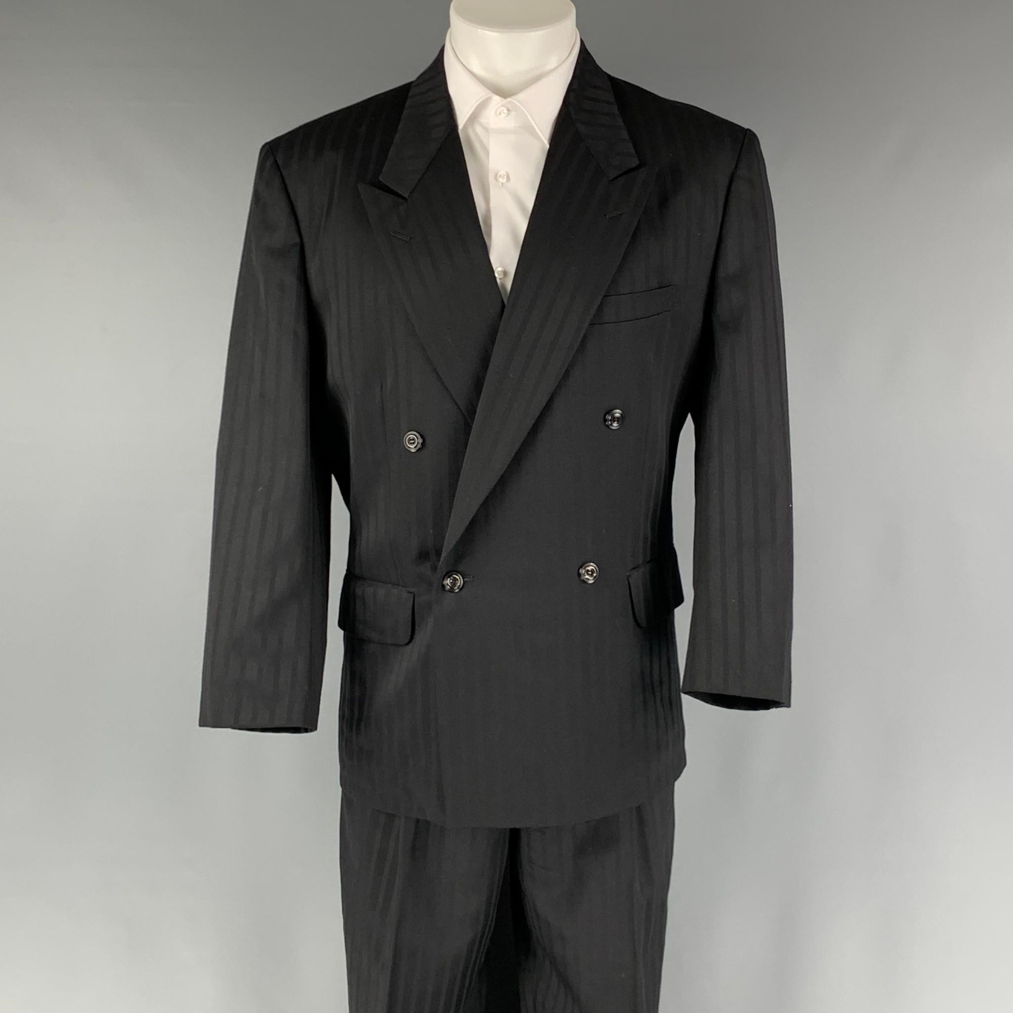 MATSUDA VINTAGE suit comes in black striped wool woven material with a full liner and includes a double breasted closure with a peak lapel and matching high waist pants. Made in Japan.

Excellent Pre-Owned Condition.
Marked: