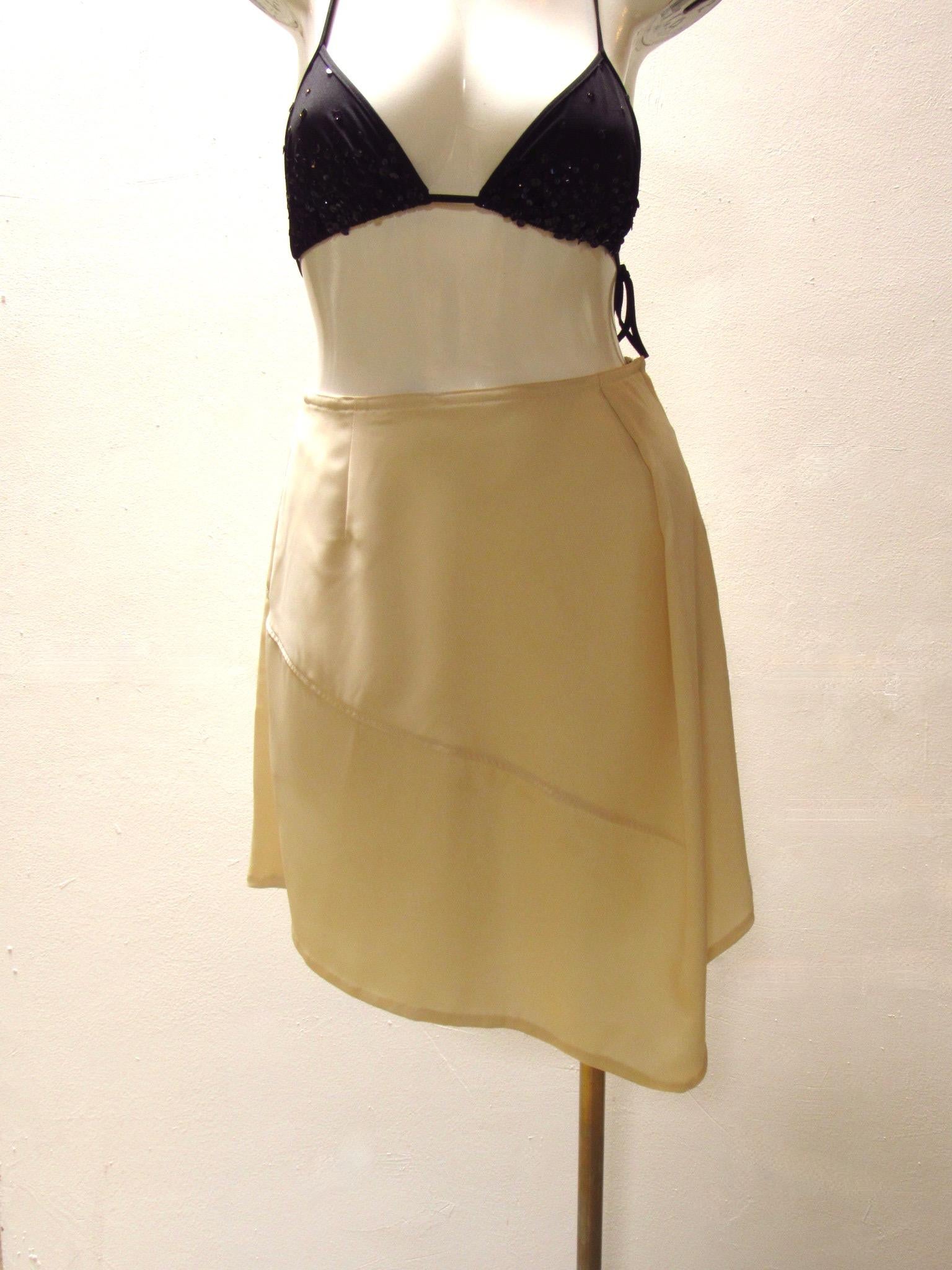 Vintage Matsuda ivory skirt has an asymmetrical hemline and side zipper.