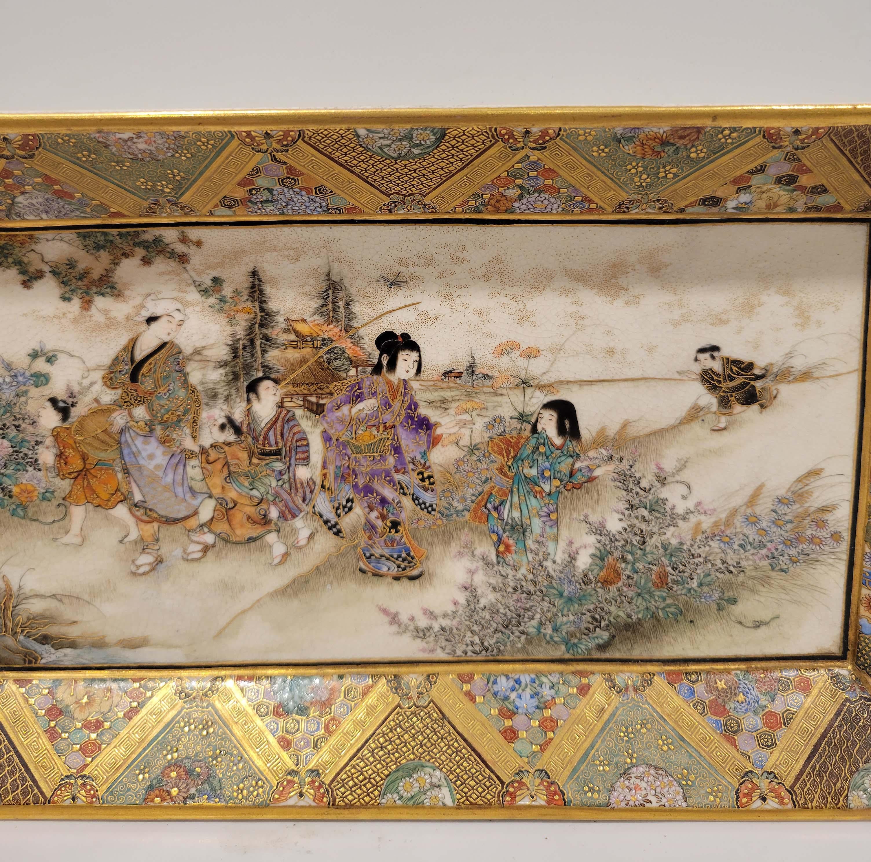 A wonderful quality 19th century Satuma rectangular platter signed Matsumoto Hozan, Meiji period, 19th Century.
Depicting a family in a garden setting. Raised enamel work and of the finest quality. In great condition. Signed with two seals