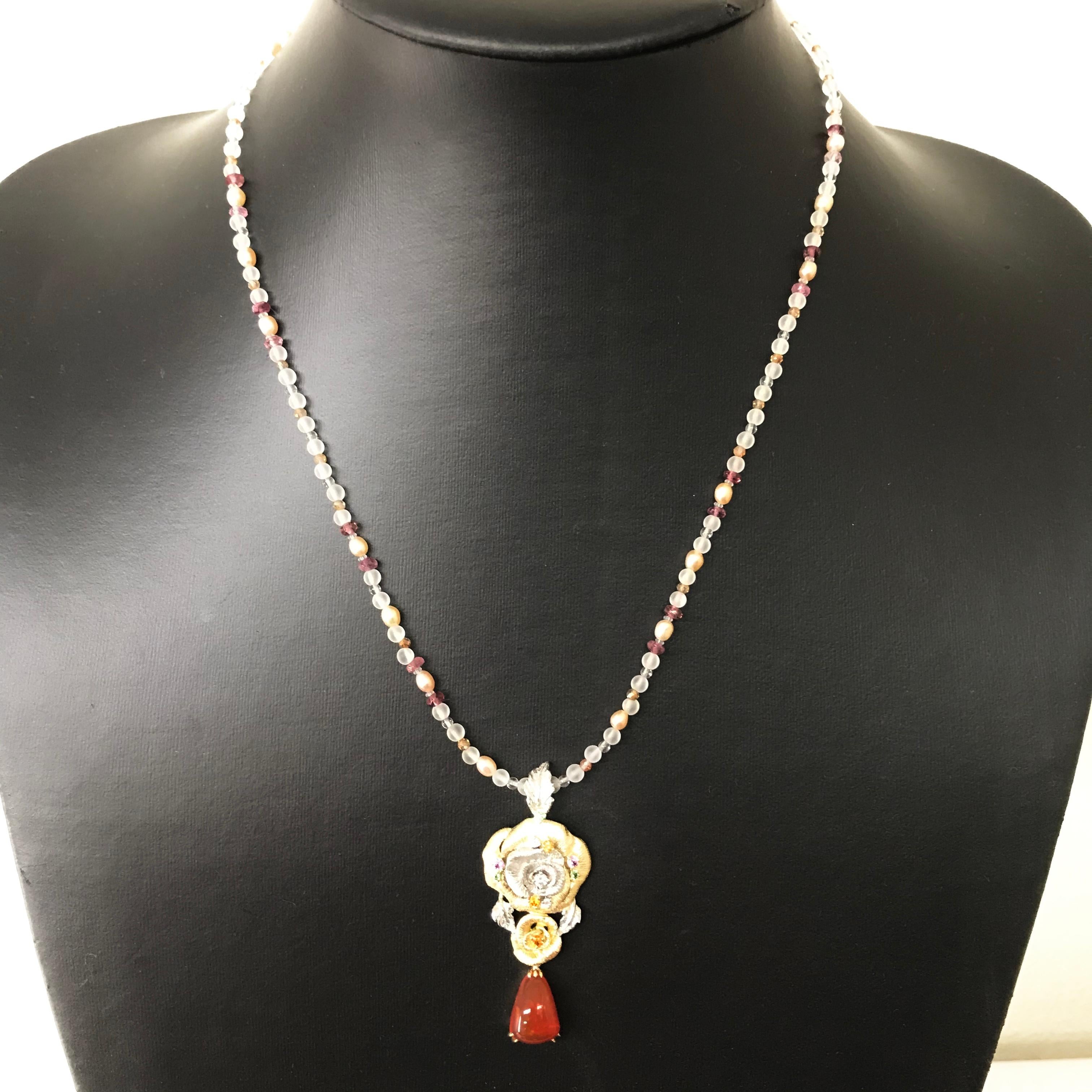 All buyers outside of Japan will receive -10% tax exemption from the list price. 
Please inquire for details.

[Detailed Information]

Pendant : K18Yellow Gold /Platinum 900
FIRE OPAL 3.02c / GARNET(GREEN & ORANGE) 0.22ct 
PINK SAPPHIRE 0.10ct /