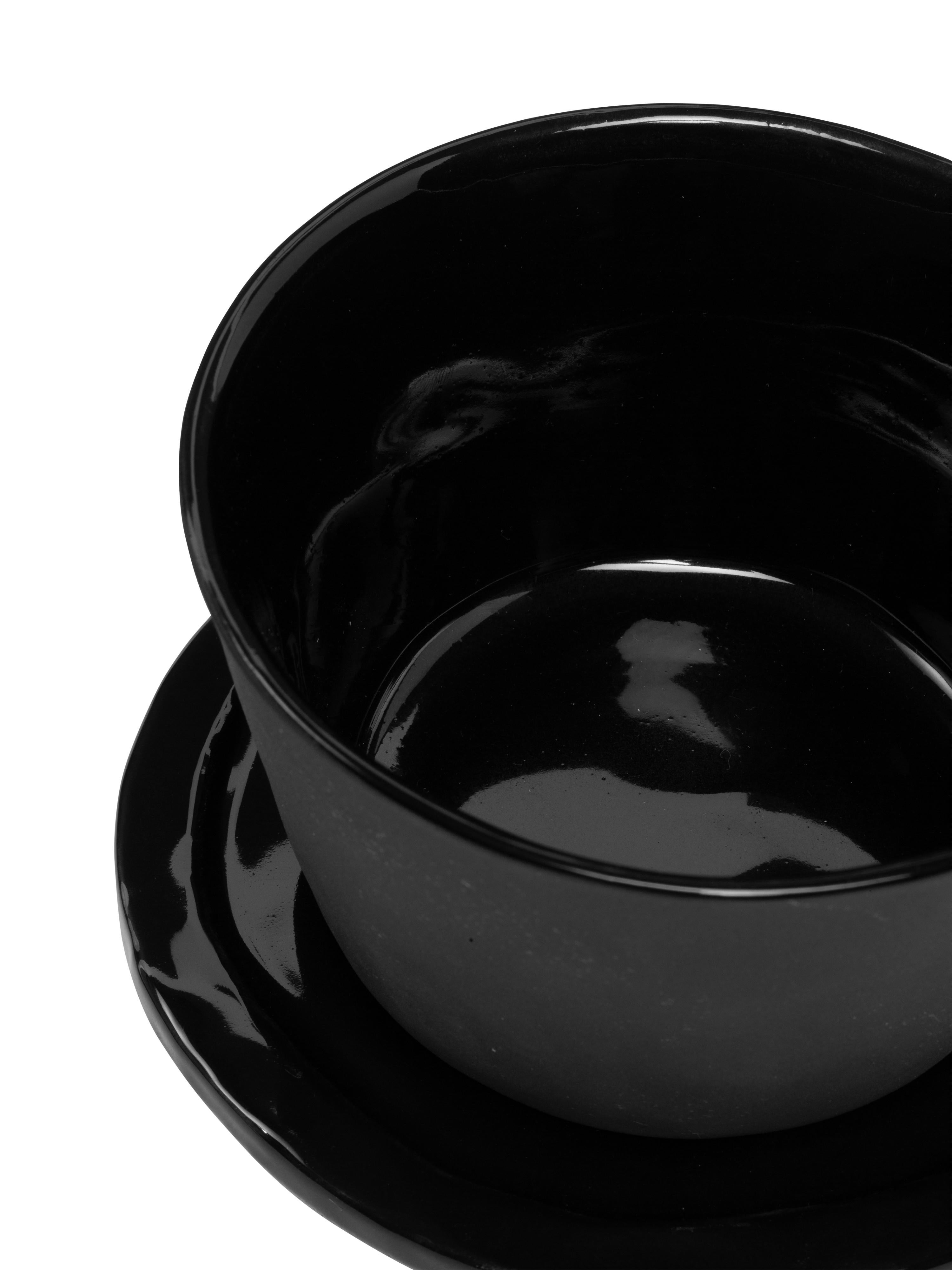 This object has been made from ceramic using an artisan method. Each piece is unique in terms of finish, colours and details. Breakfast Set finish is mat black outside and Glossy Black inside. Breakfast set includes a flat small flat plate with a