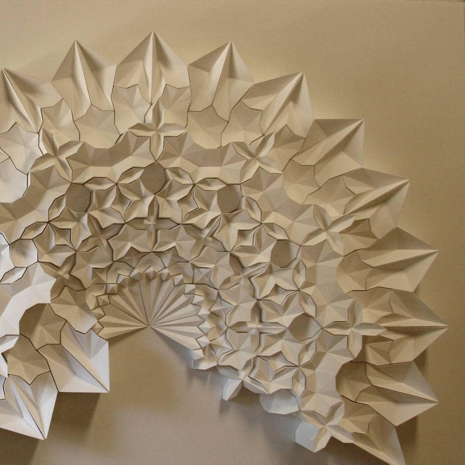 As a paper engineer, my work is rooted in print media, book arts and commercial design. Beginning with an initial fold, a single action causes a transfer of energy to subsequent folds, which ultimately manifest in drawing and three dimensional