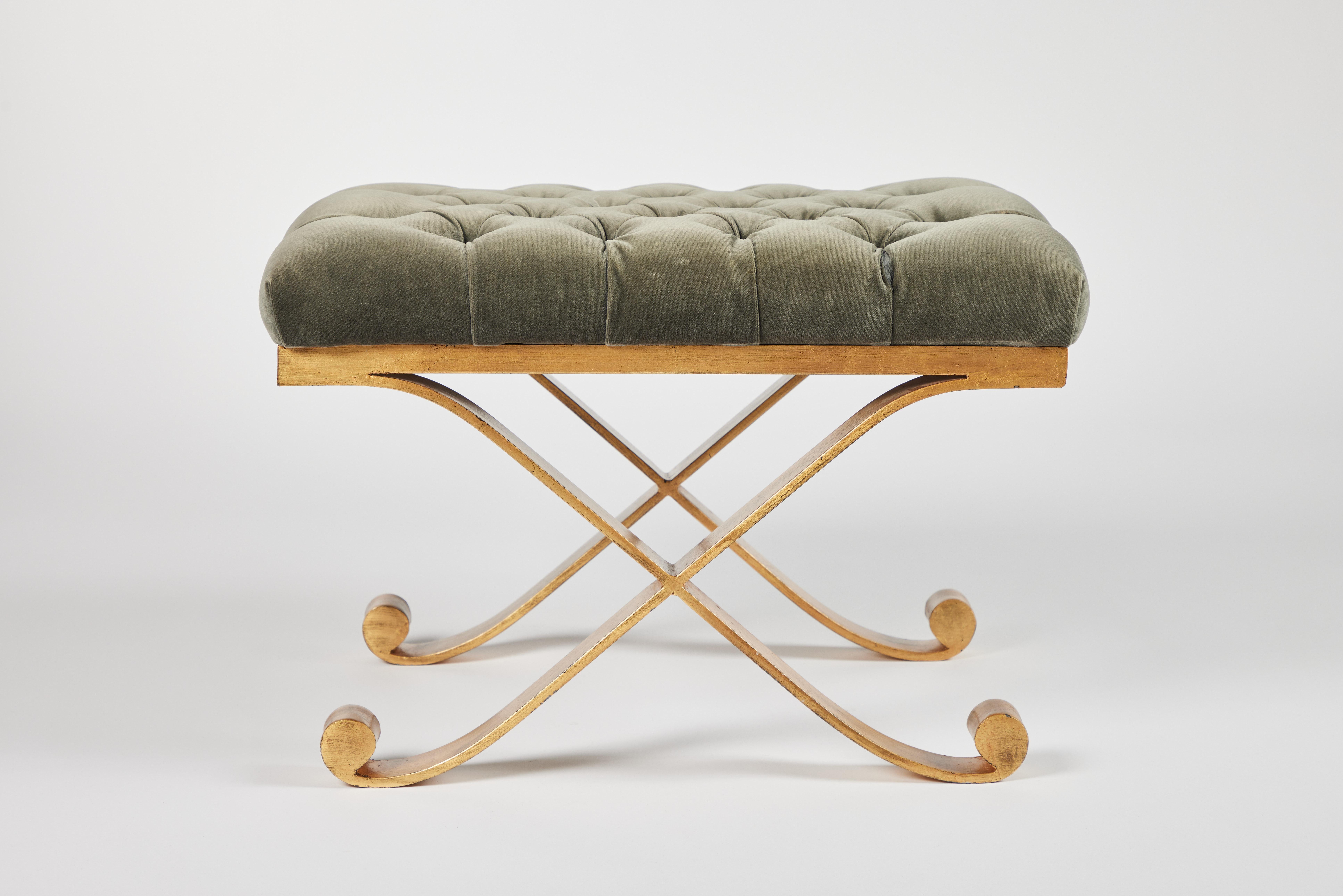 Jean Michel Frank style Anthony bench or ottoman by Mattaliano; 22K gold leaf finish on the iron X base. Tufted velvet top.