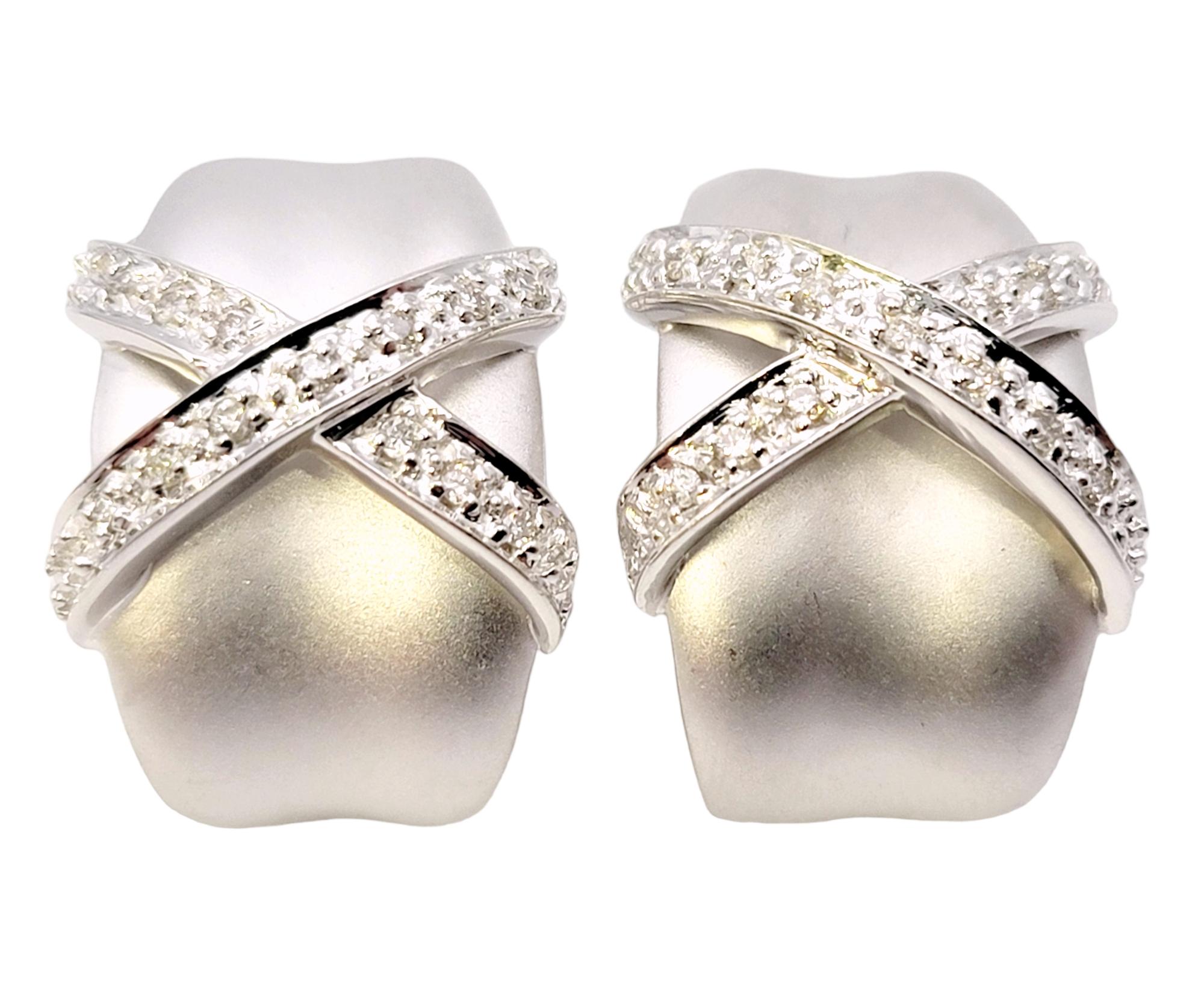 Sleek and modern half hoop earrings with dazzling diamond detailing. The pretty pair gently hugs the lobe while giving off a chic, sophisticated look that you will absolutely love. 

These gorgeous earrings feature a smooth, slightly contoured half