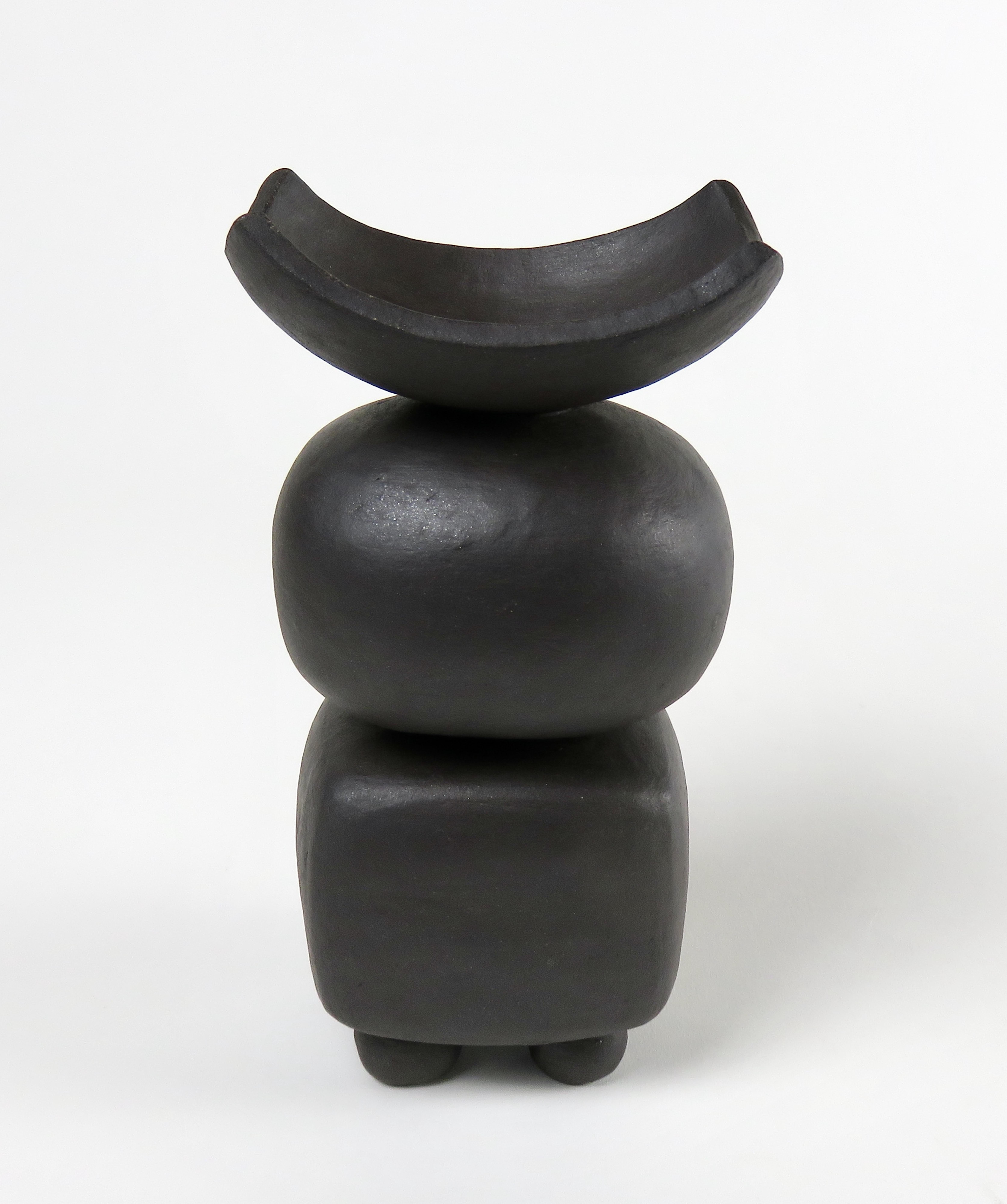 This new series of Modern TOTEMS consisting of soft round or rectangular forms on small feet. The shapes are formed of a solid piece, then hollowed out, stacked and placed on feet. A black slip is applied by brush and the pieces are fired twice.