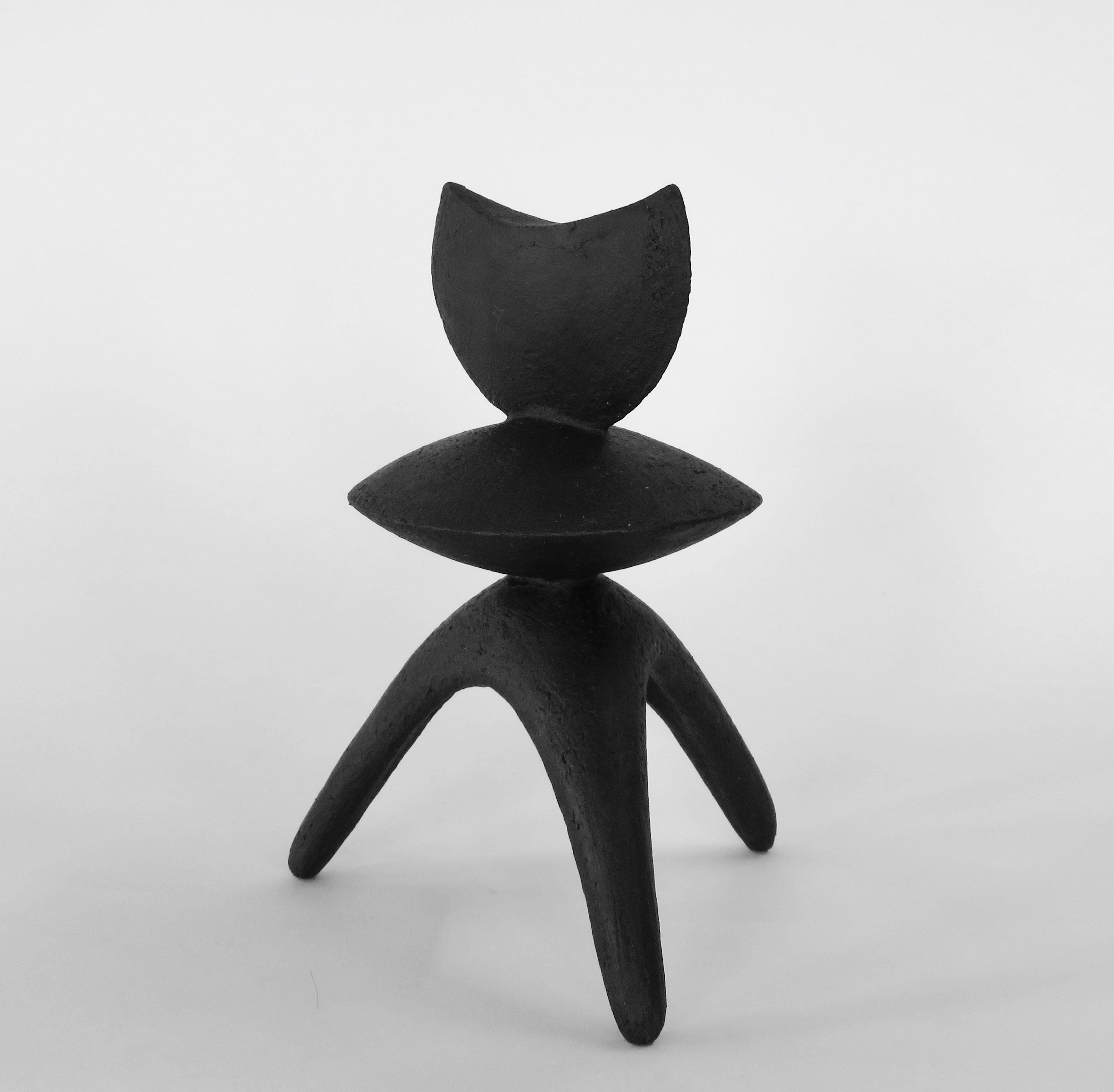 One of a trio of fully hand built ceramic TOTEMS in matte black under glazed stoneware. This one, 