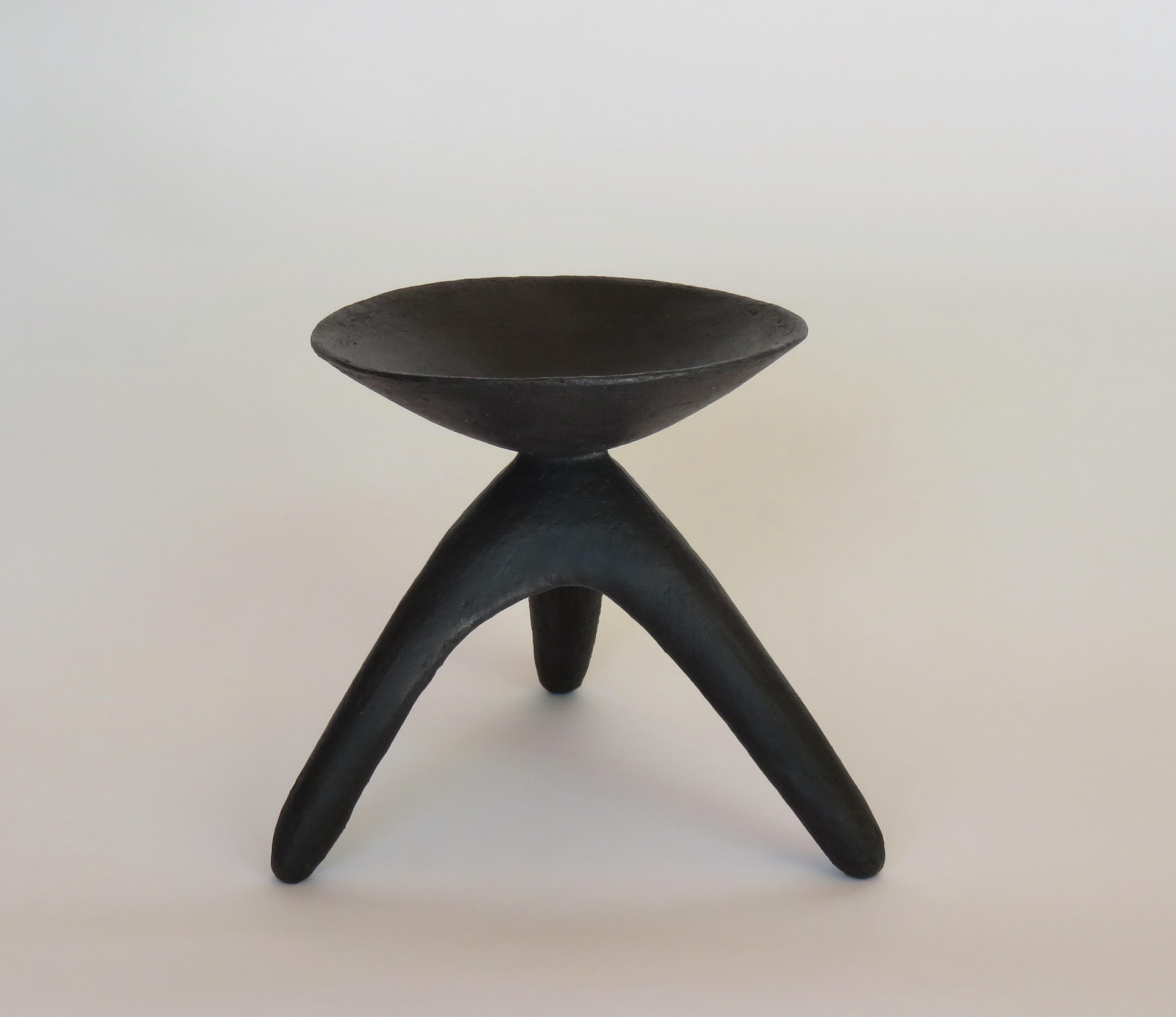 A Hand Formed Chalice on Tripod Legs, one in a series of Modern TOTEMS, in matte black, underglazed stoneware.
Each TOTEM is unique and has its own personality consisting of various hand-shaped forms connected together. This one has an open chalice