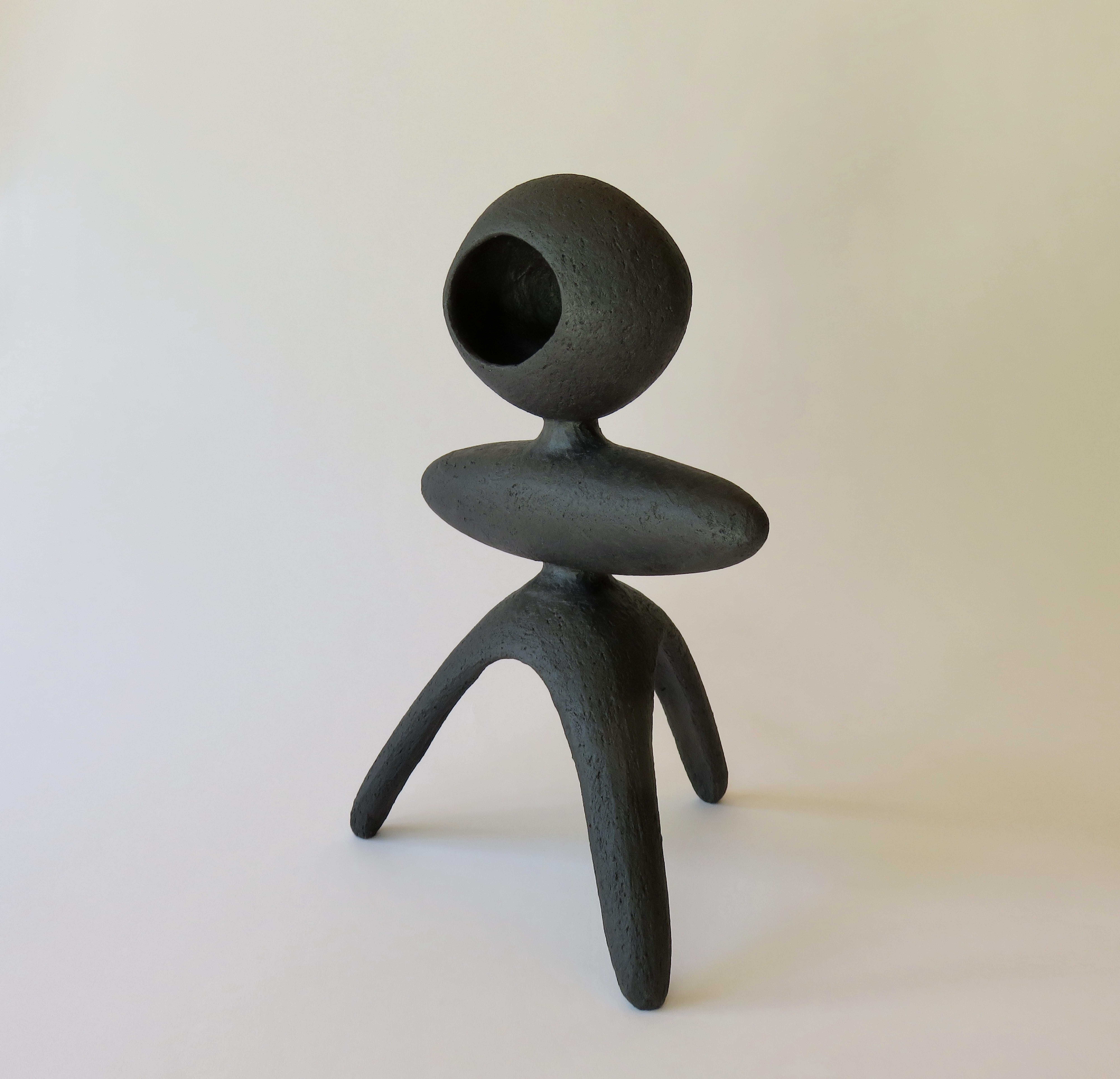 One in a series of Modern Primitive TOTEMS, in Matte Black, Underglazed Stoneware.
Each TOTEM has its own personality consisting of various hand-formed shapes connected together, and fired in the kiln. This one has an open oval top, a long