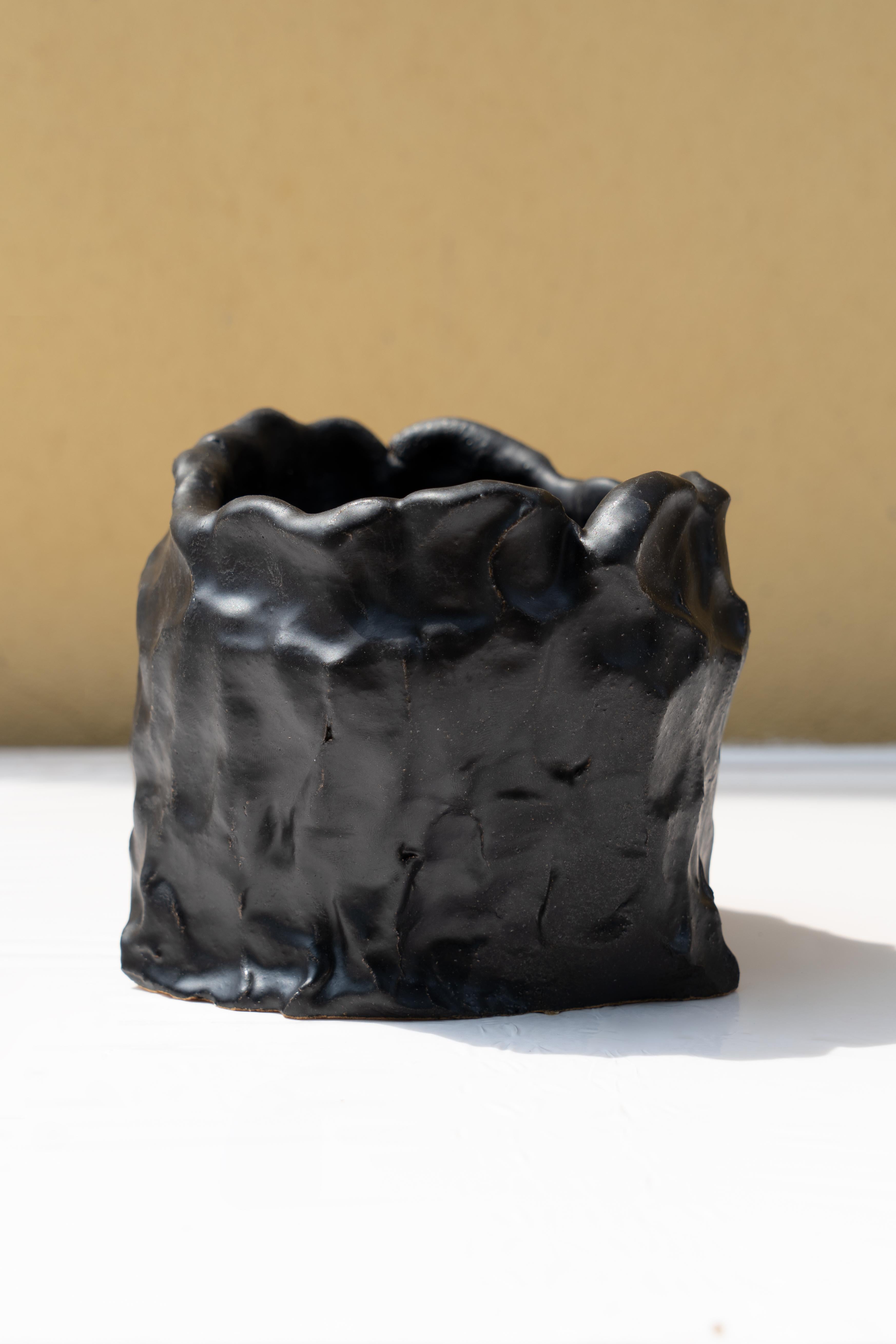 Matte Black vase by Daniele Giannetti
Dimensions: Ø 17 x H 15 cm.
Materials: Glazed terracotta. 

All pieces are made in terracotta from Montelupo, only fired once, then colored by Daniele Giannetti with a white acrylic base, and then a mixture