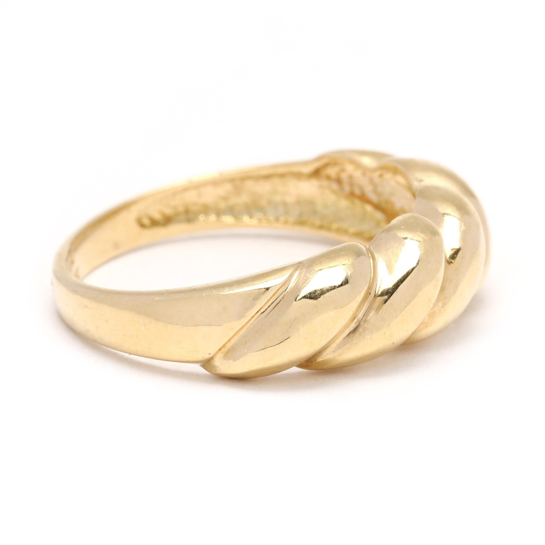 This 18K yellow gold croissant ring is the perfect addition to any stackable jewelry collection. Featuring a thin domed band for a delicate look, the ring is a size 7 and can easily be dressed up or down. With its unique design, this gold croissant