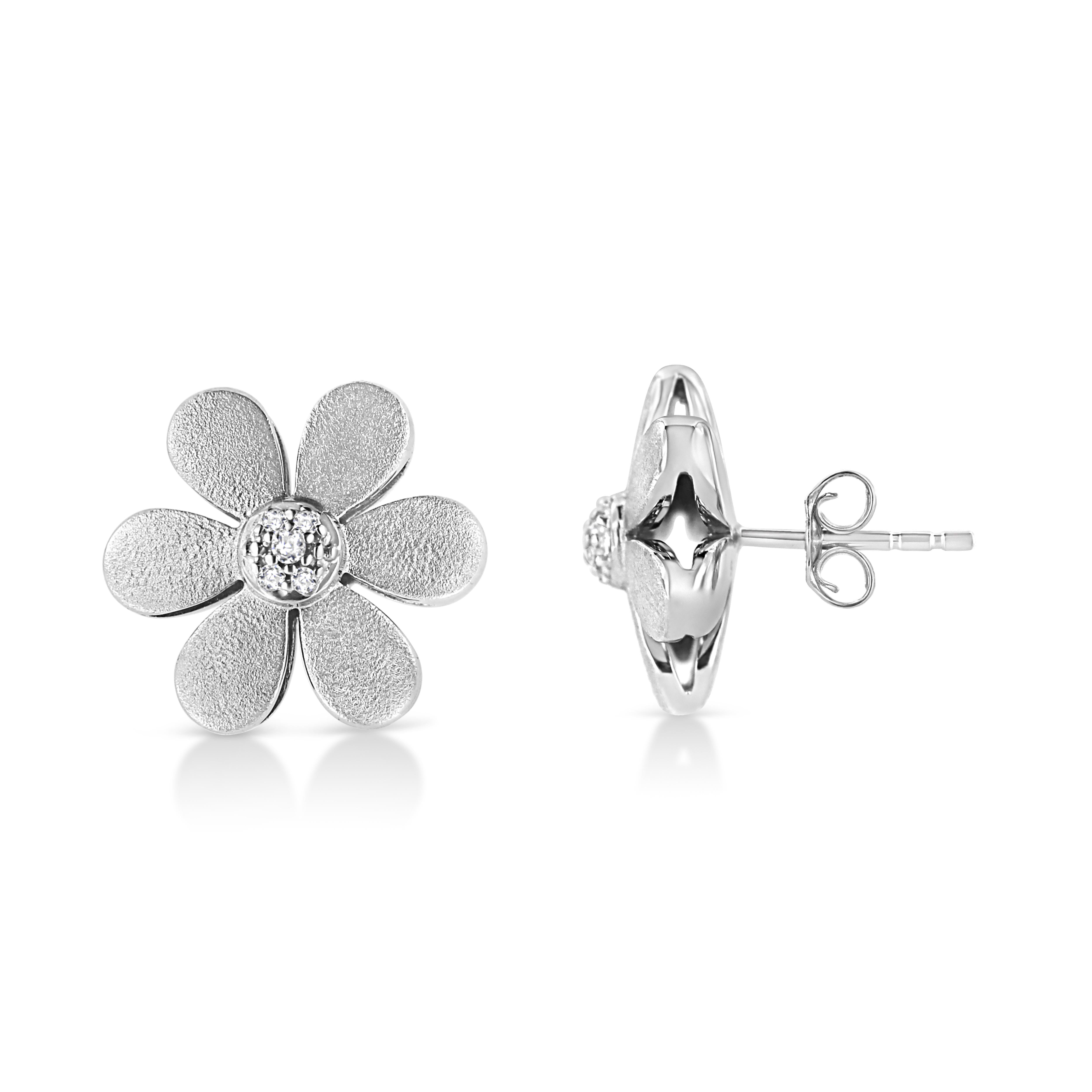 Celebrate your blooming love with these adorable diamond flower earrings made from .925 sterling silver and given a matte finish. Charming style for your sweetheart, these sterling silver floral earrings are embellished by a cluster of 10 pave set