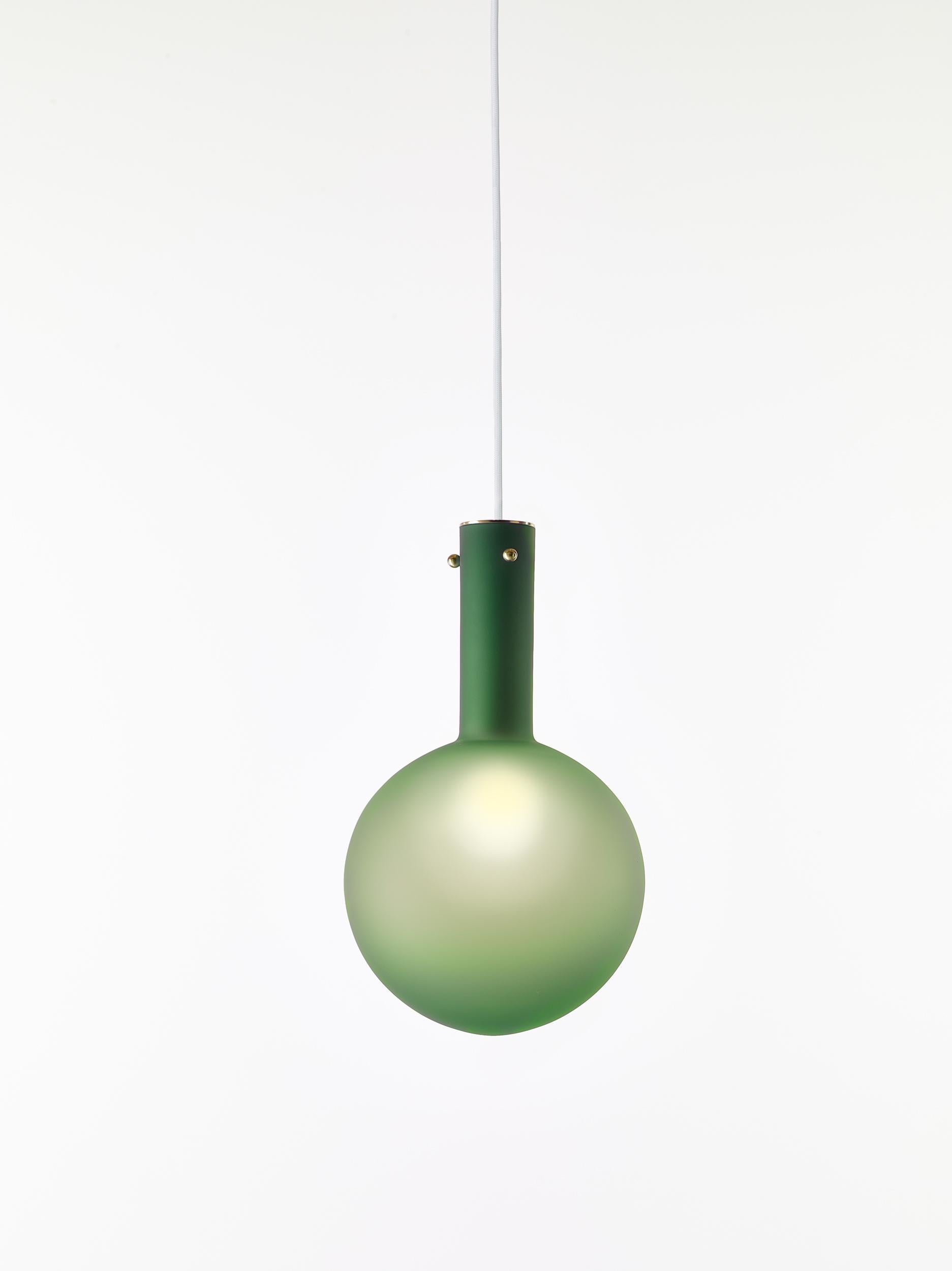 Matte green sphaerae pendant light by Dechem Studio
Dimensions: D 20 x H 180 cm
Materials: brass, metal, glass.
Also available: different finishes and colours available,

Only one homogenous piece of hand-blown glass creates the main body of