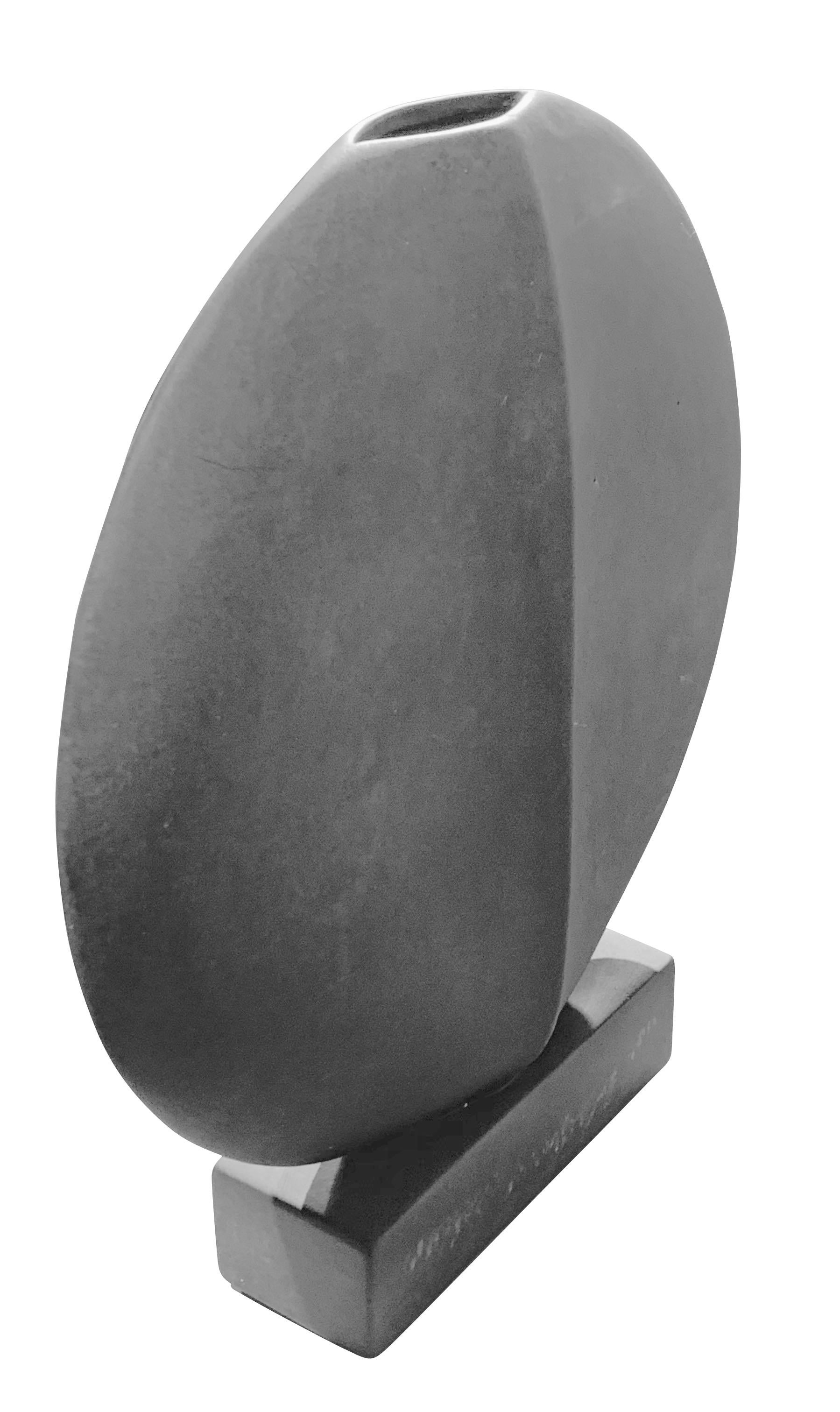 Contemporary Danish design thin round ceramic vase on self stand.
Decorative center seam.
Matte grey glaze.
One of a collection of many shapes and sizes.
  
   
  