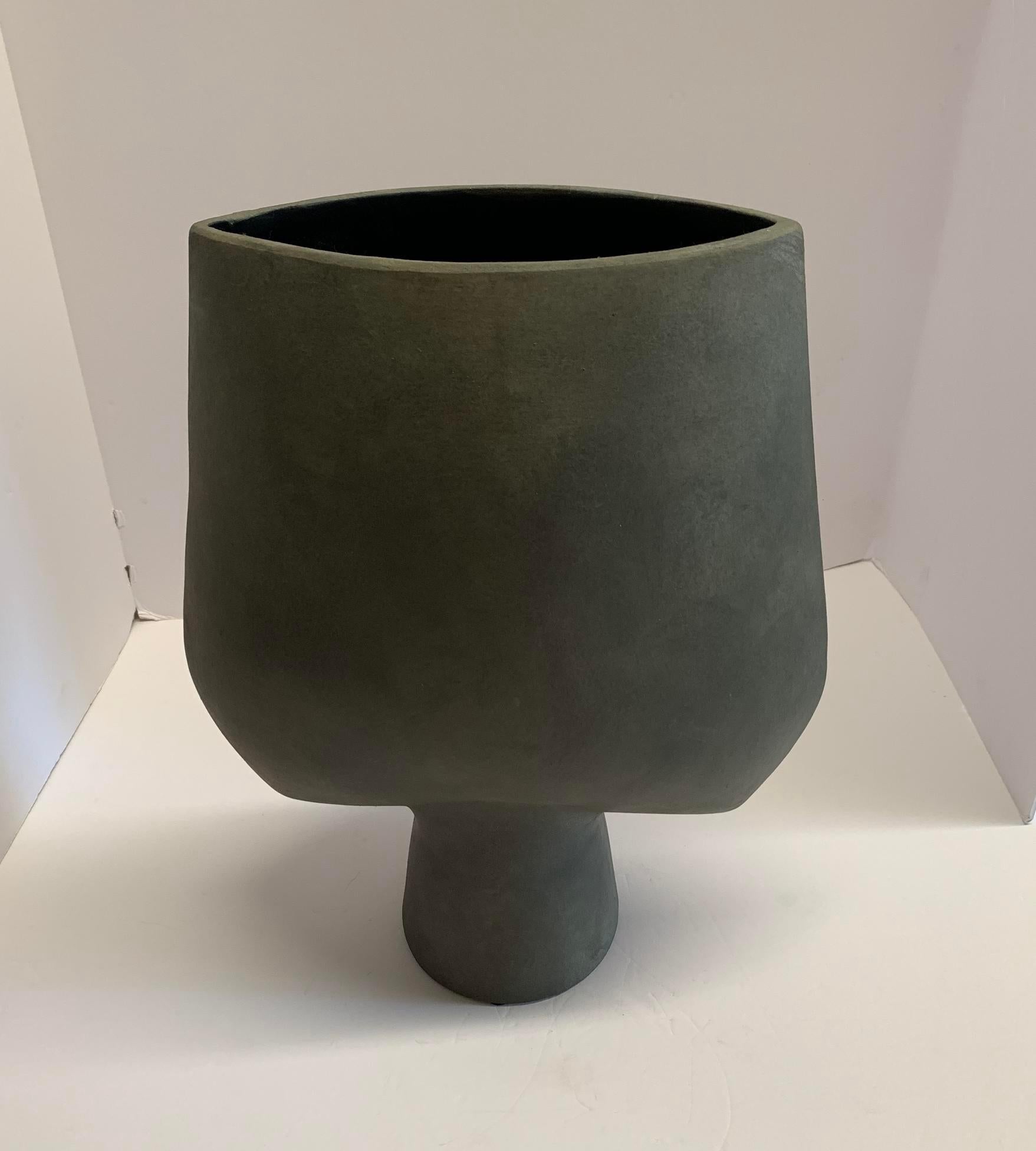 Contemporary Danish design tall matte grey ceramic vase.
Arrow shaped top with tubular shaped base.
Matte grey glaze.
One of a collection of many shapes and sizes.
Two available and sold individually.

 