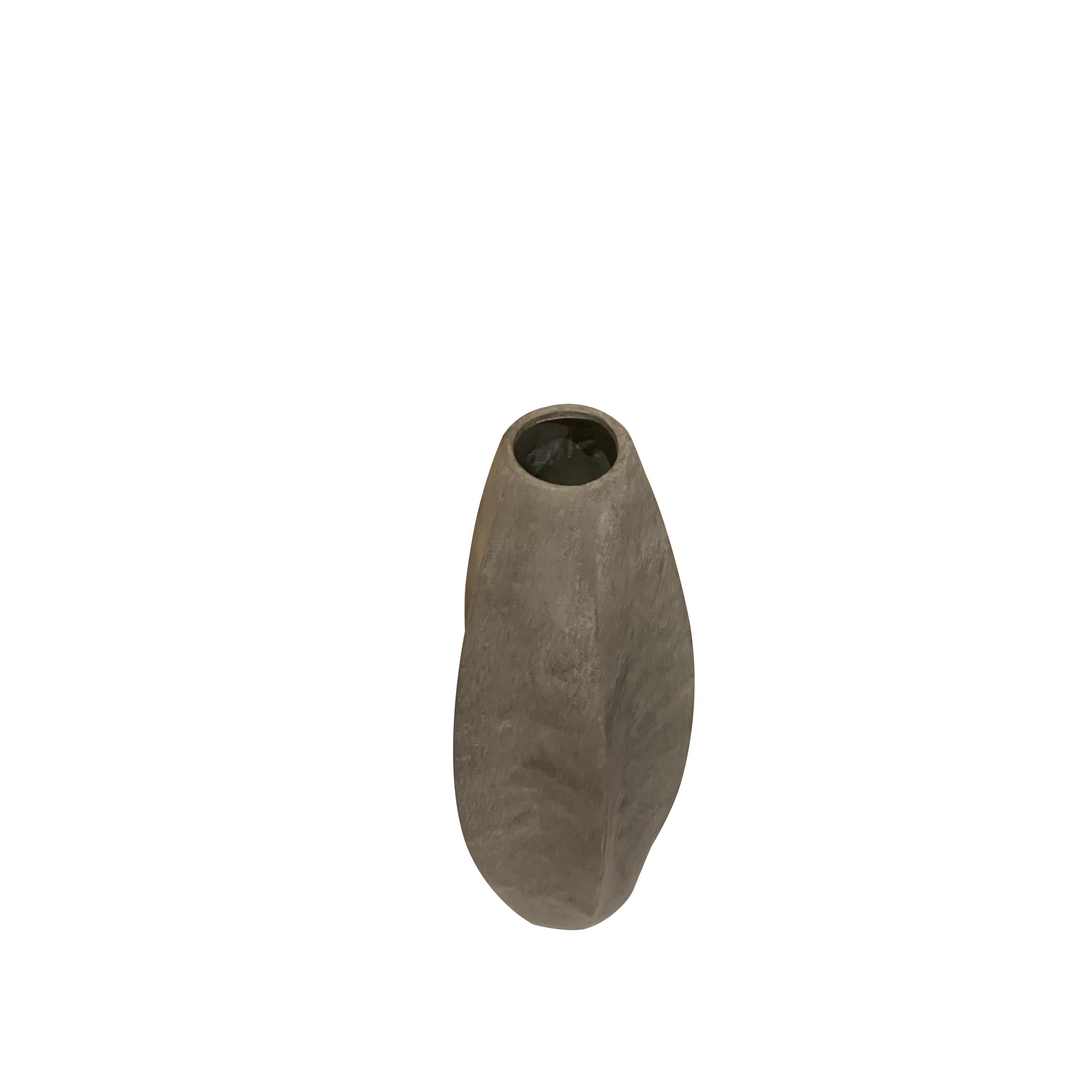 Contemporary Danish matte grey glaze ceramic vase.
Tall cylinder shape with inverted curves.
One of a collection of many shapes and sizes.
