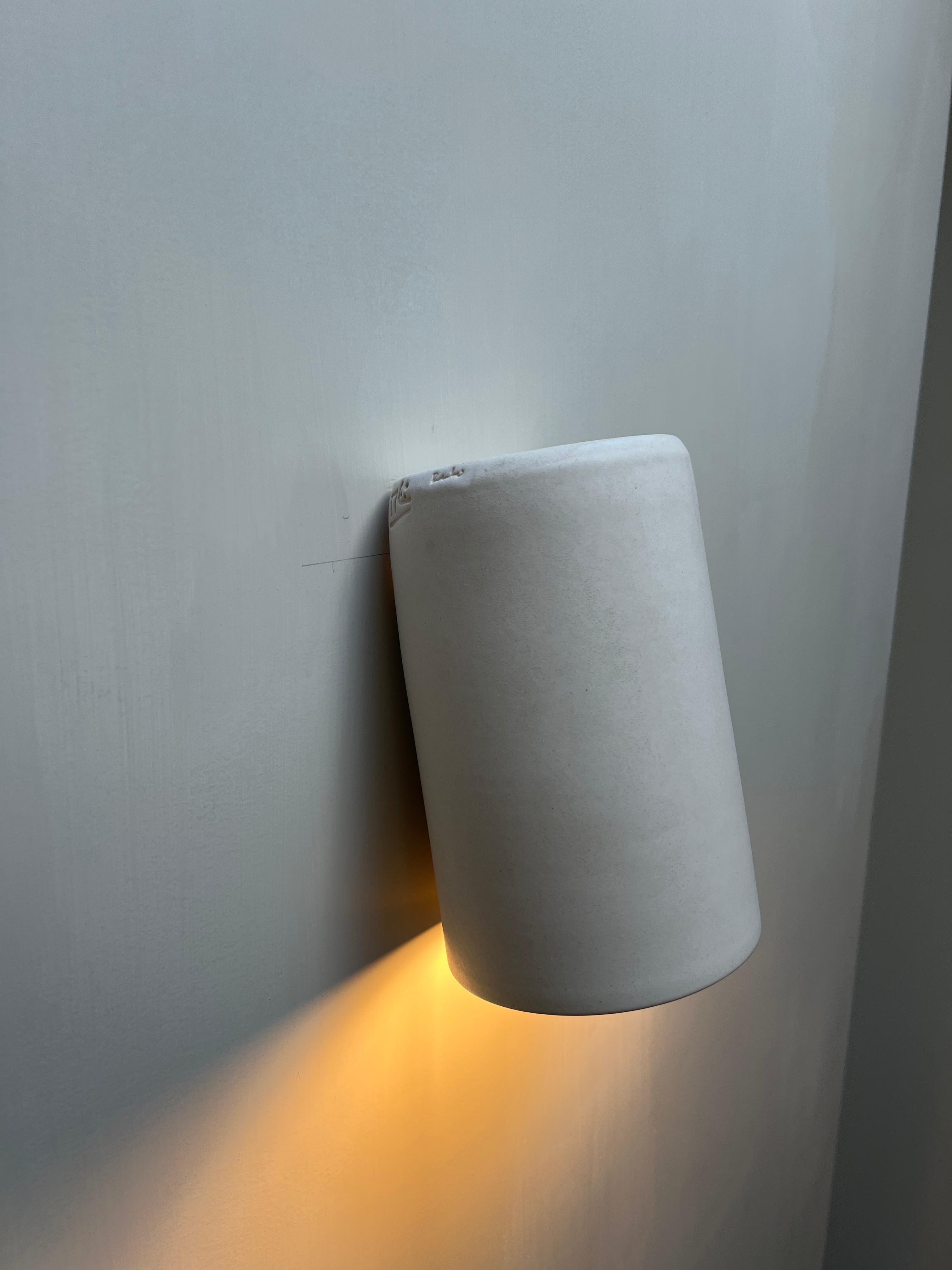 Hand-Crafted matte off-white wall light made of glazed ceramic, blends in with the wall For Sale