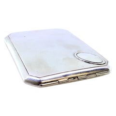 Matte silver case with beveled corners, friezes and gold interior