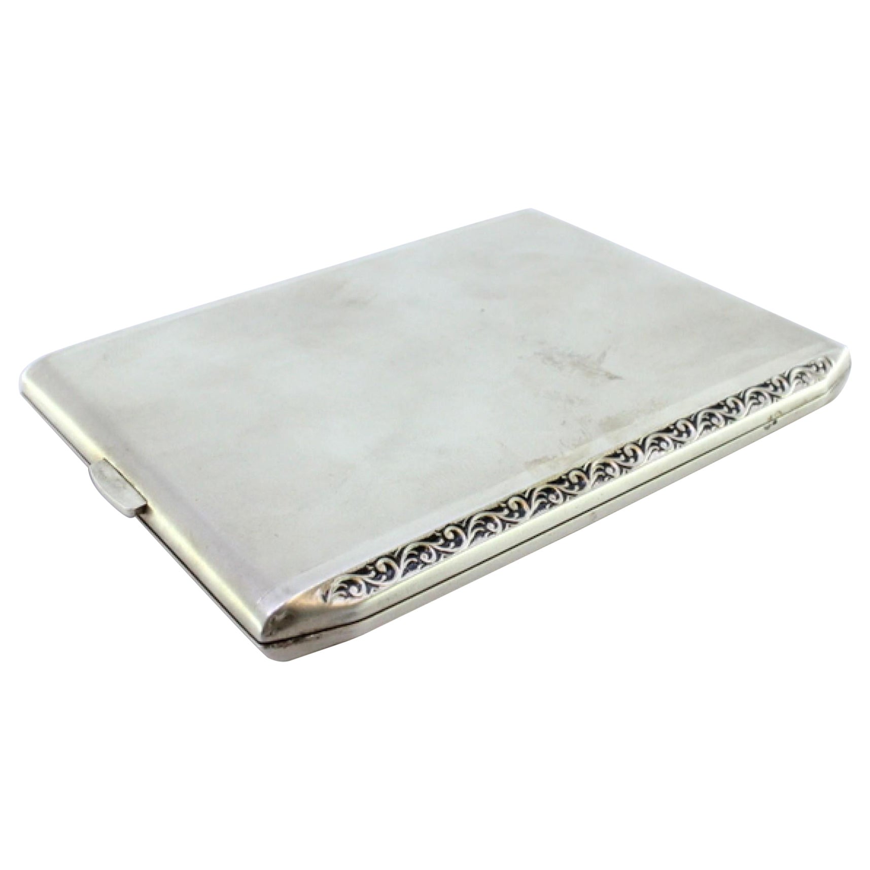 Matte silver cigarette case w/ raised strips along the length
gold interior