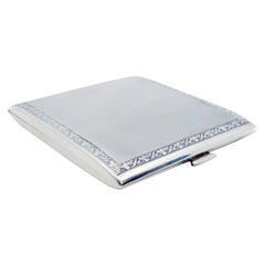 Matte silver cigarette case with borders on the edge and hinged lid