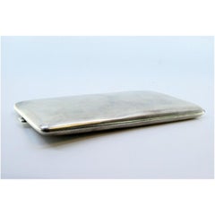 Matte silver cigarette case with gold interior and hinged lid
