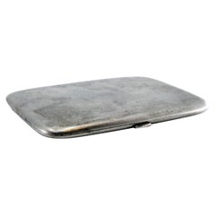 Matte silver cigarette case with gold interior and hinged lid
