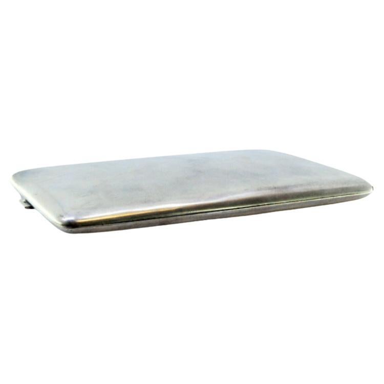 Matte silver cigarette case with gold interior and hinged lid