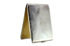 Matte silver cigarette case with raised trim, gold interior and hinged lid