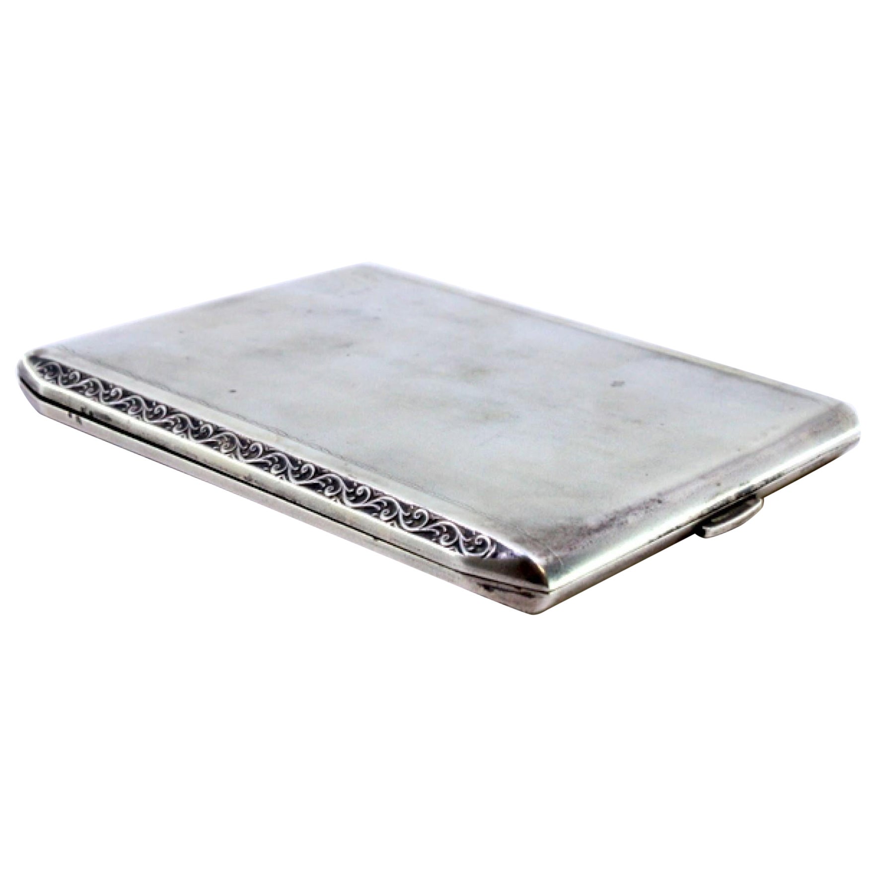 Matte silver cigarette case with raised trim, gold interior and hinged lid