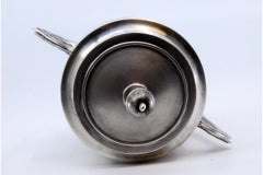 Matte silver sugar bowl with embossed flowers and removable lid
