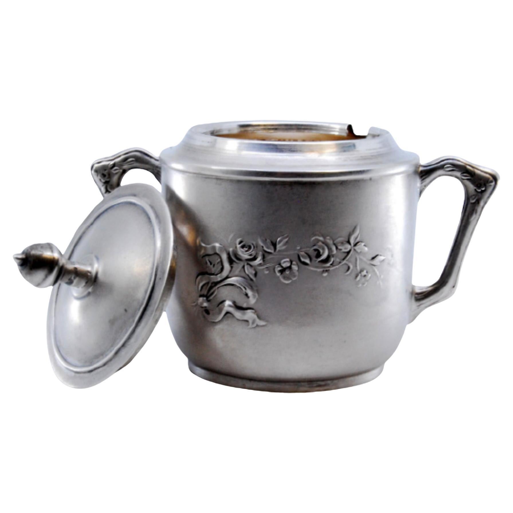 Matte silver sugar bowl with embossed flowers and removable lid For Sale