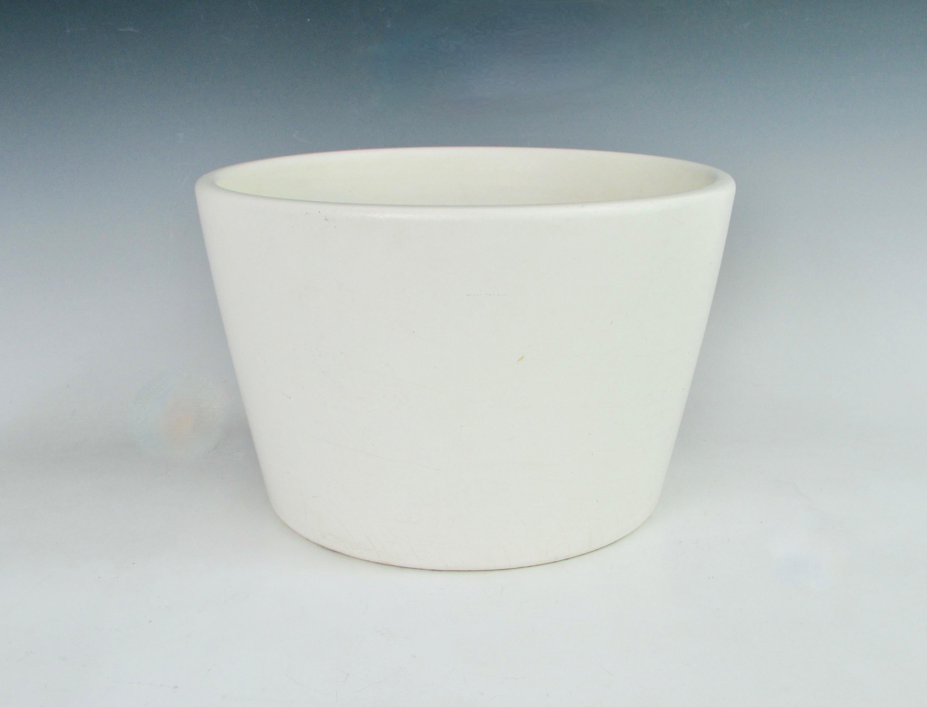 Marked only with USA on the underside. I am attributing this matte white planter pot to Architectural pottery. Possibly Gainey as well. Measures 7.75 tall diameter tapers from 12 at top down to 9.5 at base. Very clean outer glaze interior shows