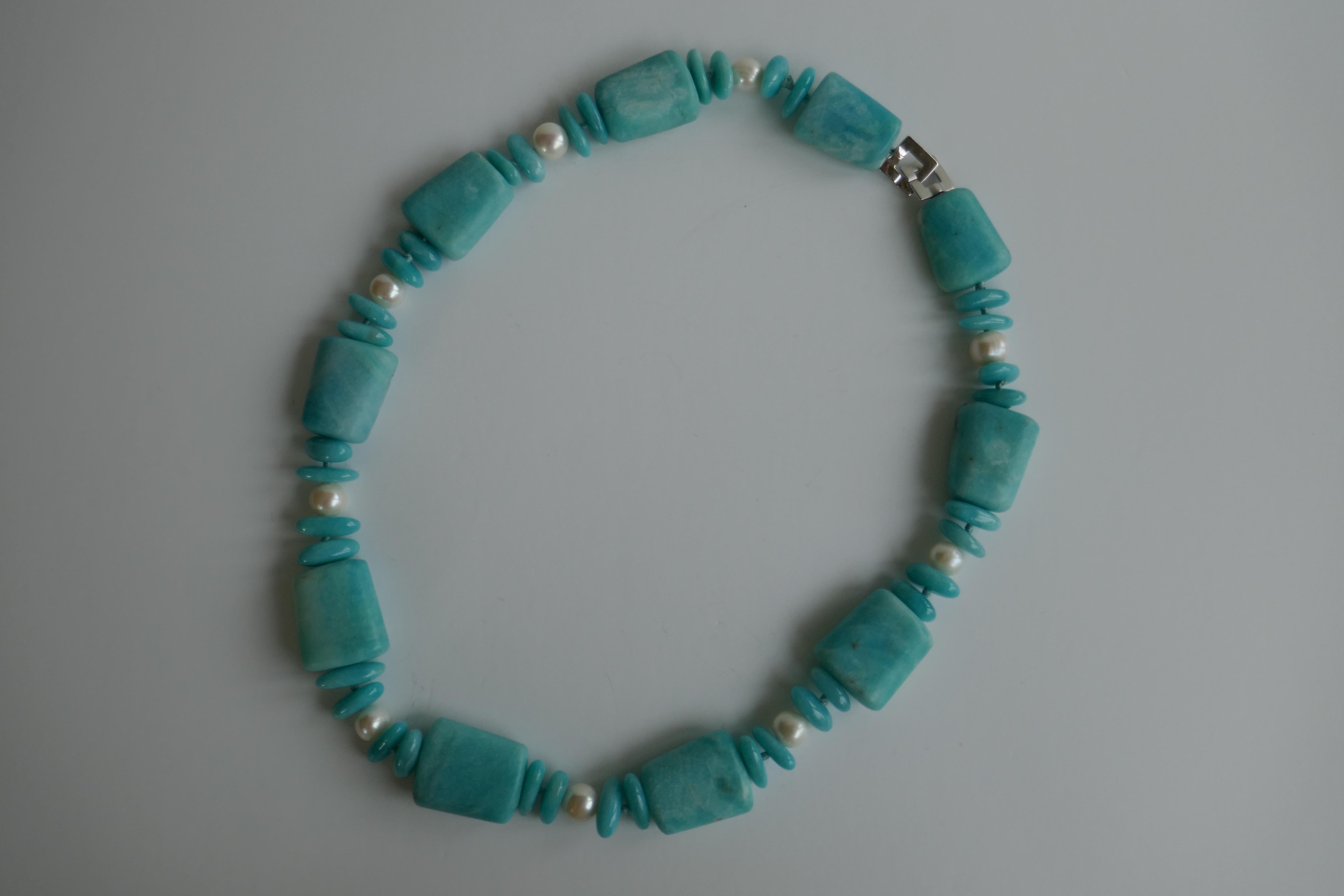 Love amazonite, similar to turquoise in color. The play of this necklace is in the matted amazonite with the polished amazonite nuggets (18-20mm) and the white cultured fresh water pearls with a 925 sterling silver clasp. It's a statement necklace