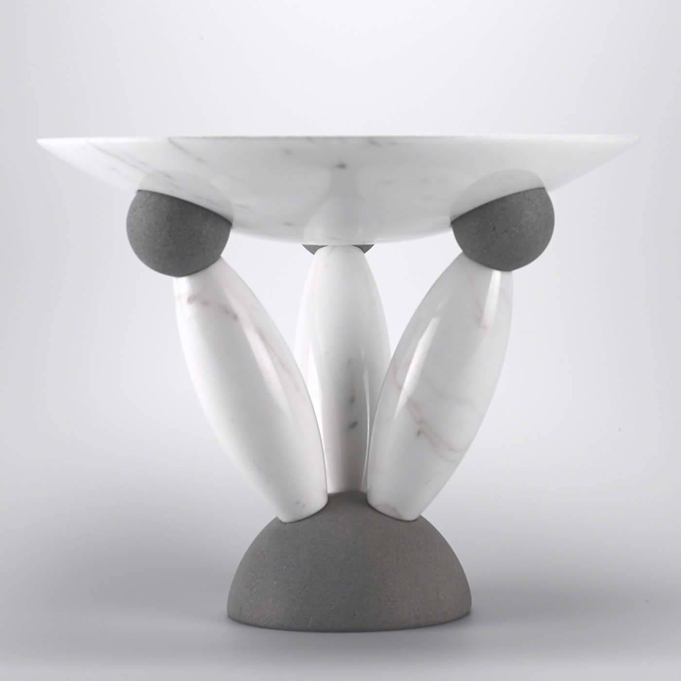 This unique bowl was designed by Matteo Thun and makes a statement whether used for holding fruit or as an outstanding display piece. Made of the highest quality Italian natural stone, it features a shallow bowl in white marble atop a sculptural,