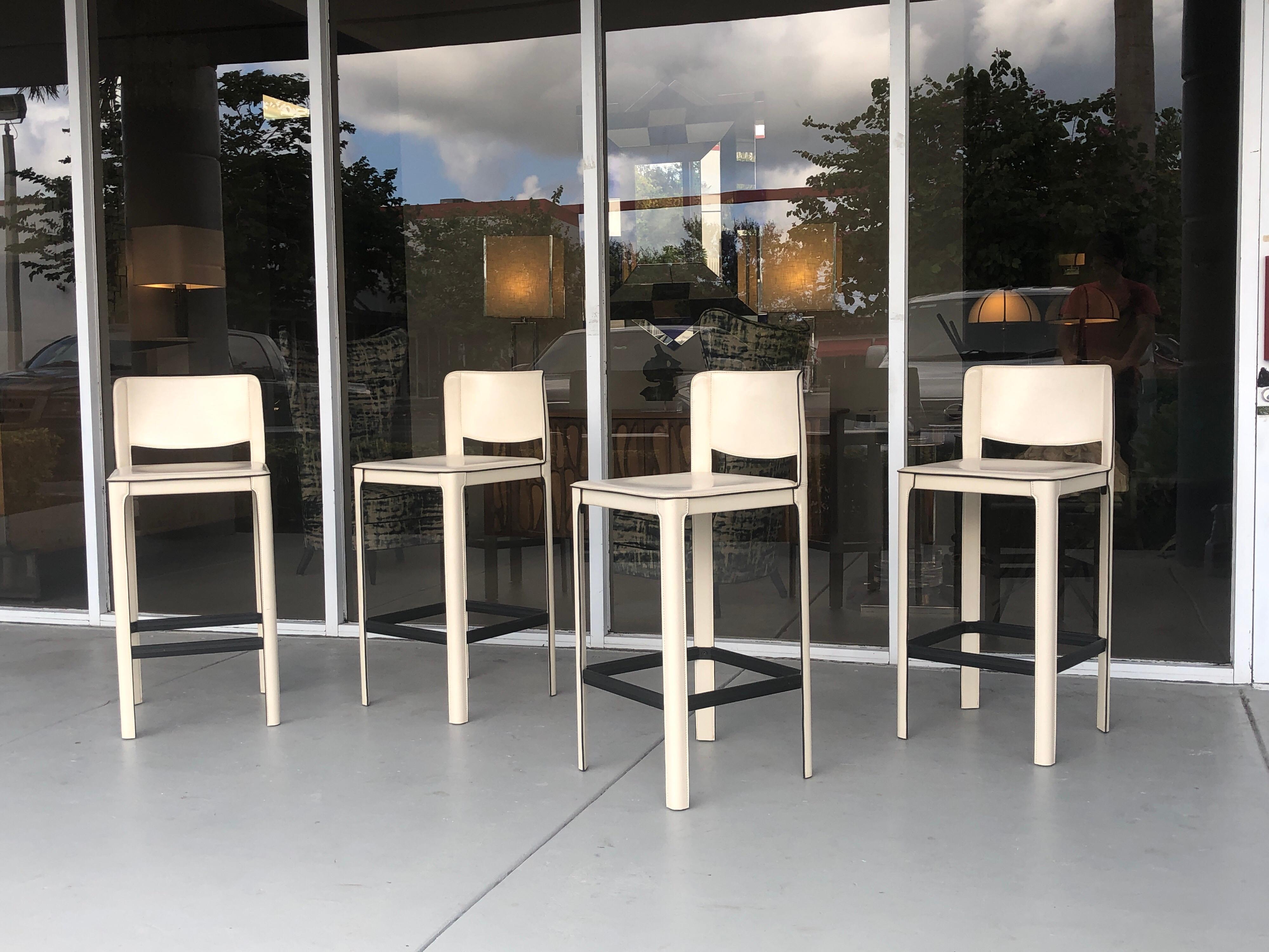 A set of 4 leather bar stools by Matteo Grassi. Modern Minimalist design. In very good condition.