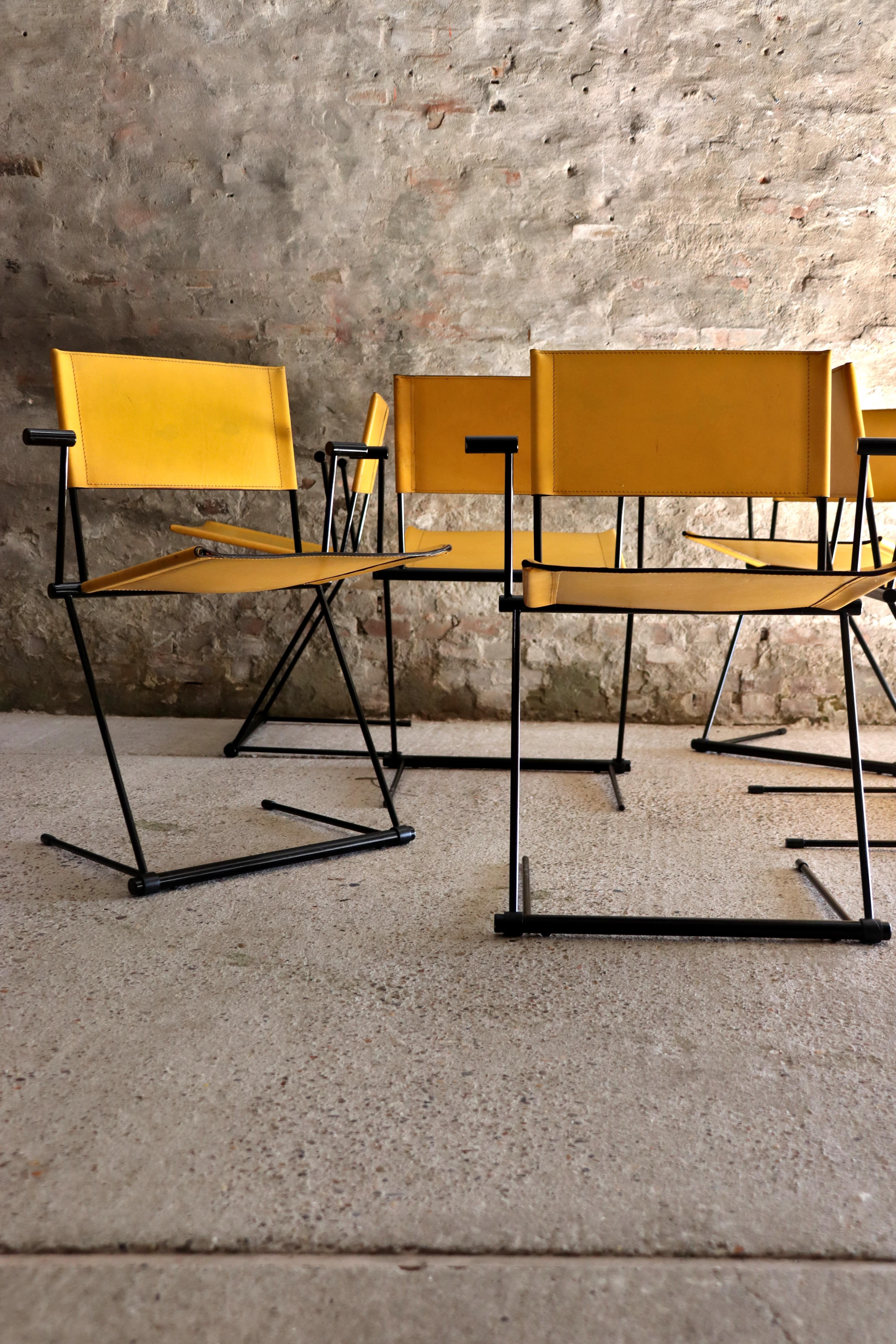 These cool chairs are called Ballerina and were designed by Herbert Ohl and manufactured by Matteo Grassi in Italy. The cantilever chairs are made of black lacquered spring steel. The seat and backrest are made of solid yellow leather. Great