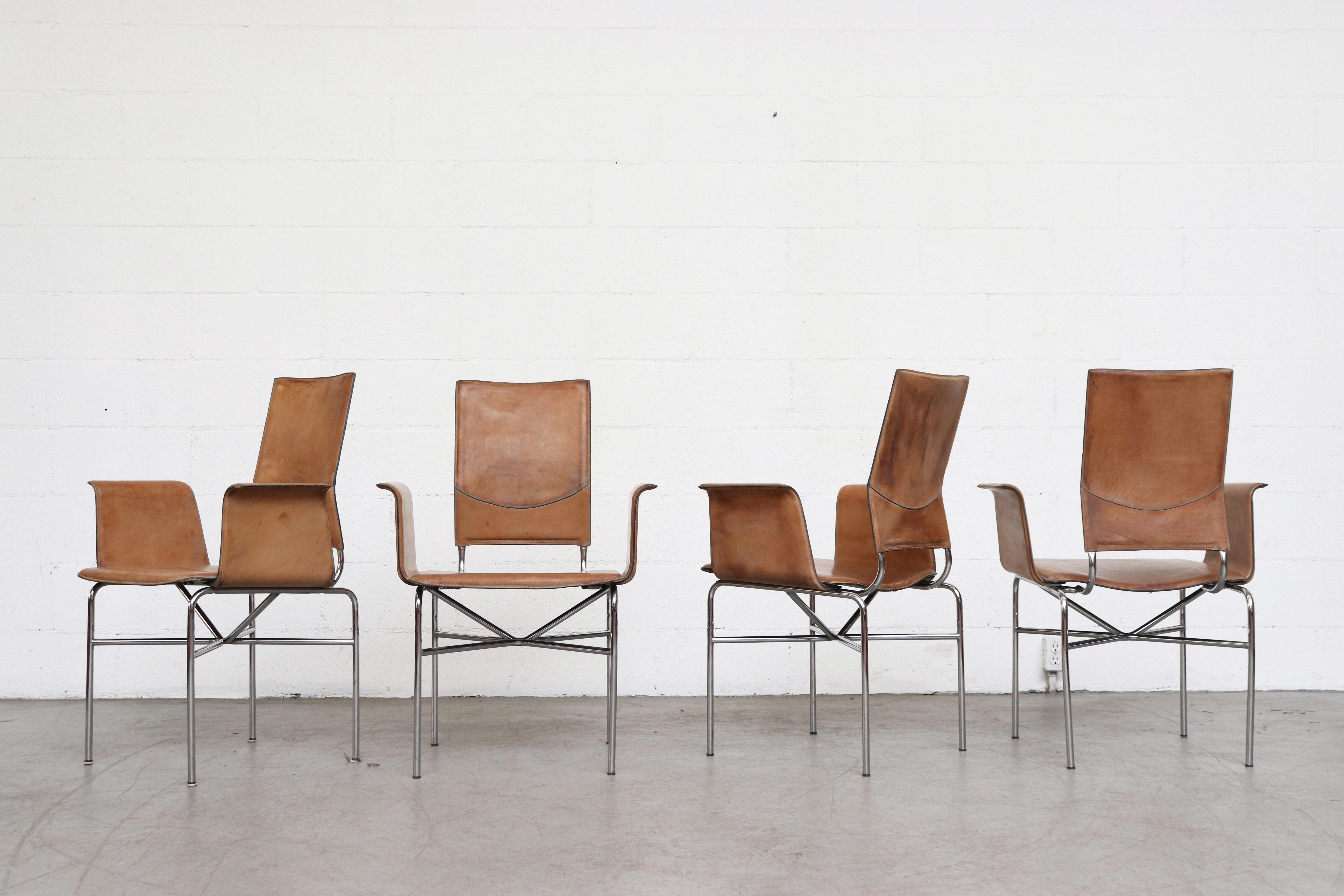 Set of 4 Matteo Grassi leather wing chairs with natural leather seating and chrome frames. Originally in grey painted leather. The original grey paint has been stripped to expose the beautiful natural leather. Printed Matteo Grassi logo on leather
