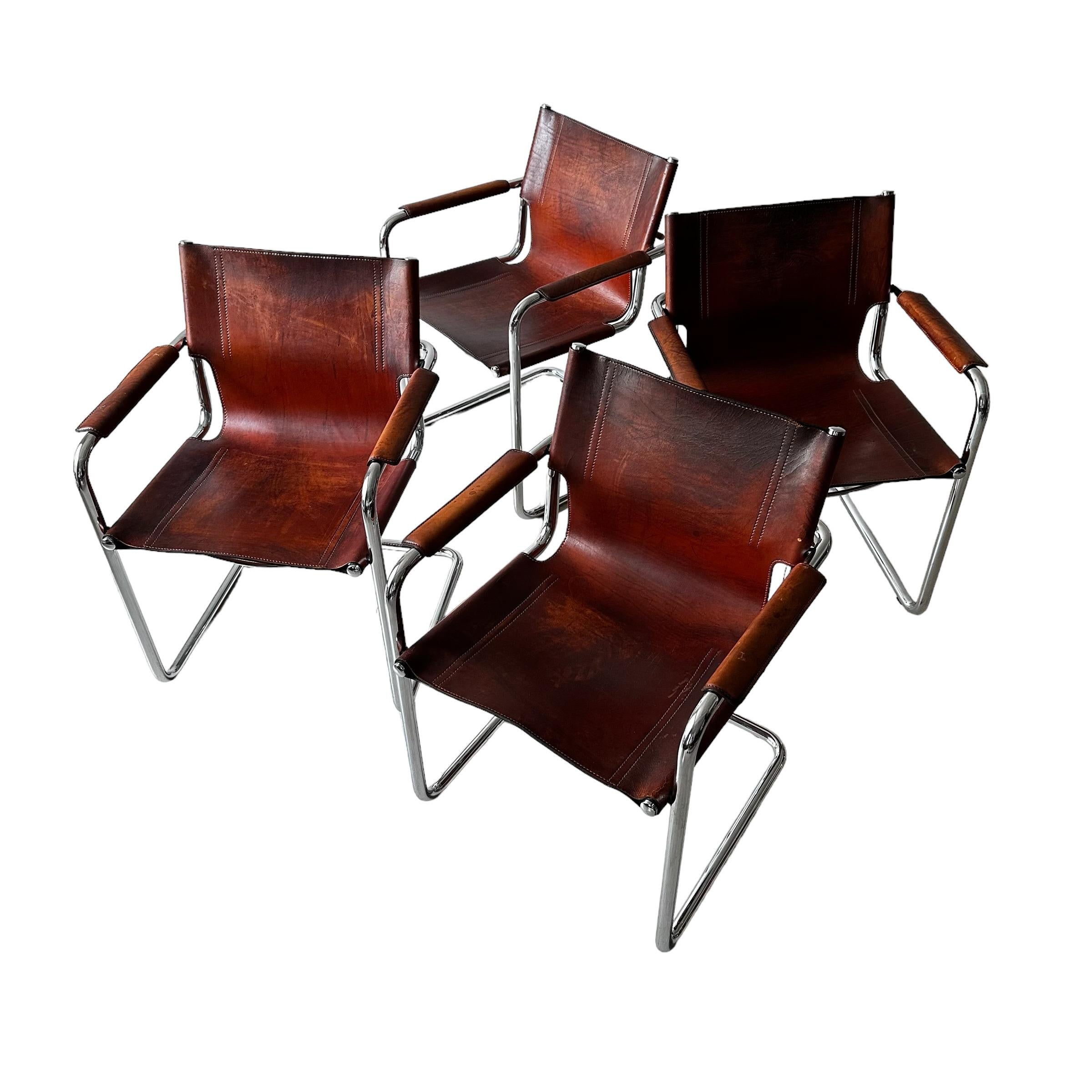 Rare set of 4 cantilever armchairs in very patinated cognac leather by Matteo Grassi. Amazing patina that is so sought after and impossible to re-create. Made in Italy in the 1970s.