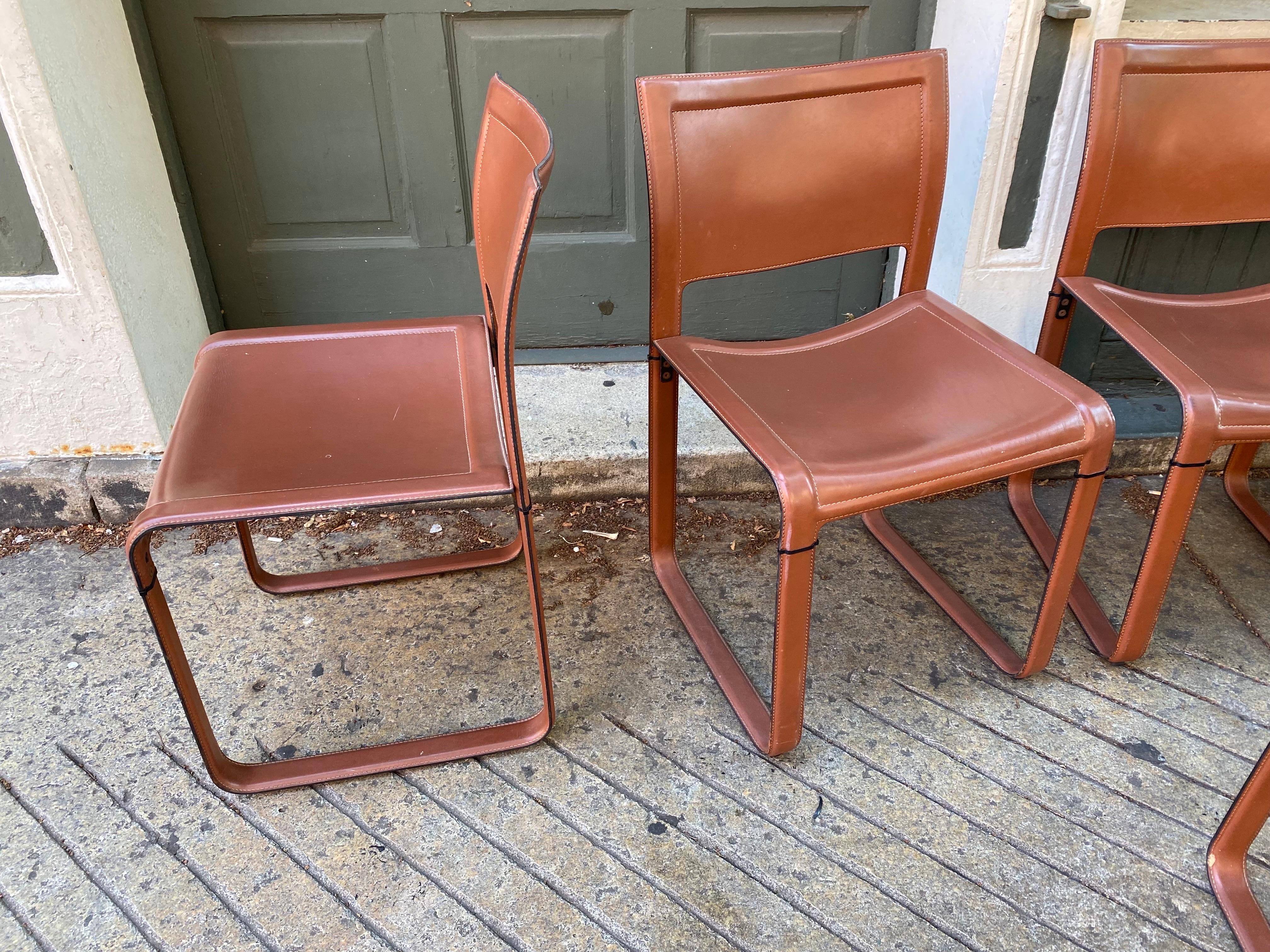 Set of 8 Matteo Grassi leather dining or conference chairs. In nice original condition showing minimal wear. Chairs have great stitch detail and can be placed with all kinds of tables. Simple elegant Italian design!.