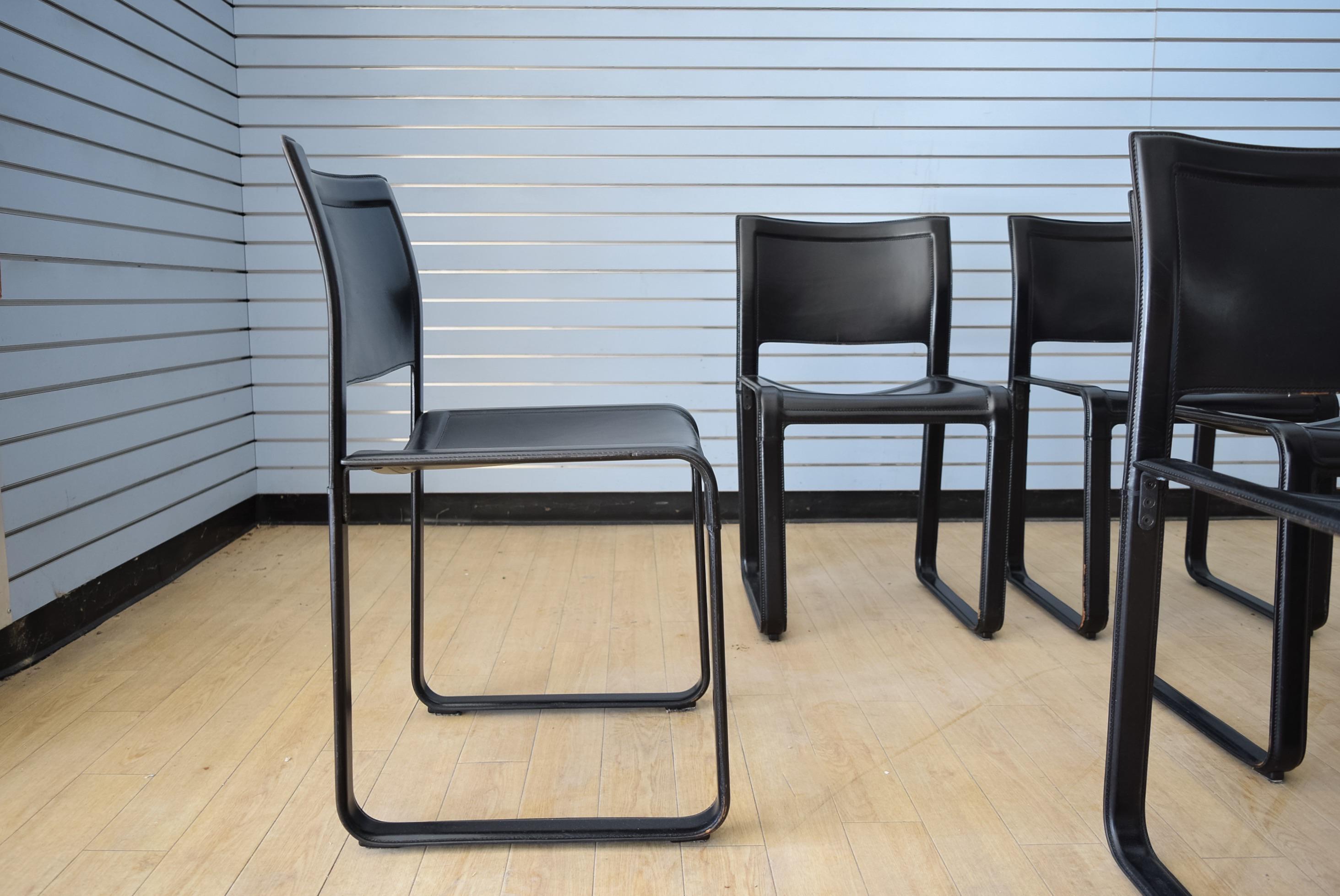 Note: Listing is for one chair. Three matching chairs available. Two chairs have been sold.

Classic Matteo Grassi Sistina black leather dining chairs designed by Tito Agnoli. Finely crafted. Clean Italian design. Rigid metal frames wrapped in