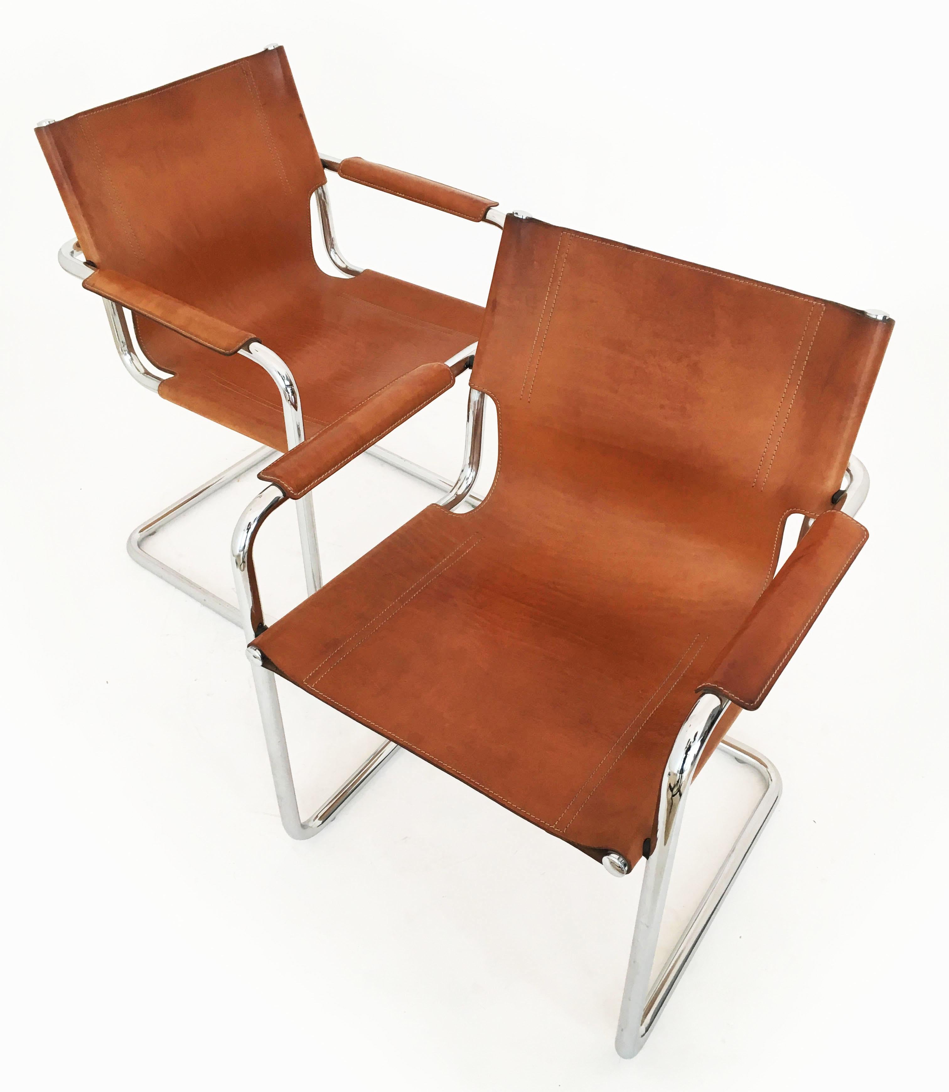 A fantastic pair Matteo Grassi 'Visitor' chairs in original beautifully aged patinated cognac leather, Italy 1970s. Signed embossed leather, Matteo Grassi.