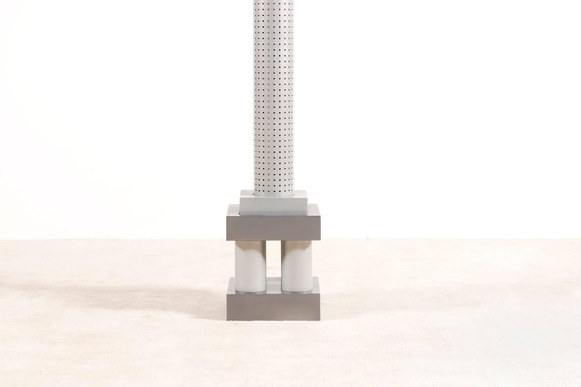 Very nice floor lamp model Chicago Tribune designed by Matteo Thun and Andrea Lera in 1984 for Bieffeplast Padua, Italy.
The floor lamp consists of grey and silver enameled metal and a perforated shade.
Three neon tubes illuminate this floor