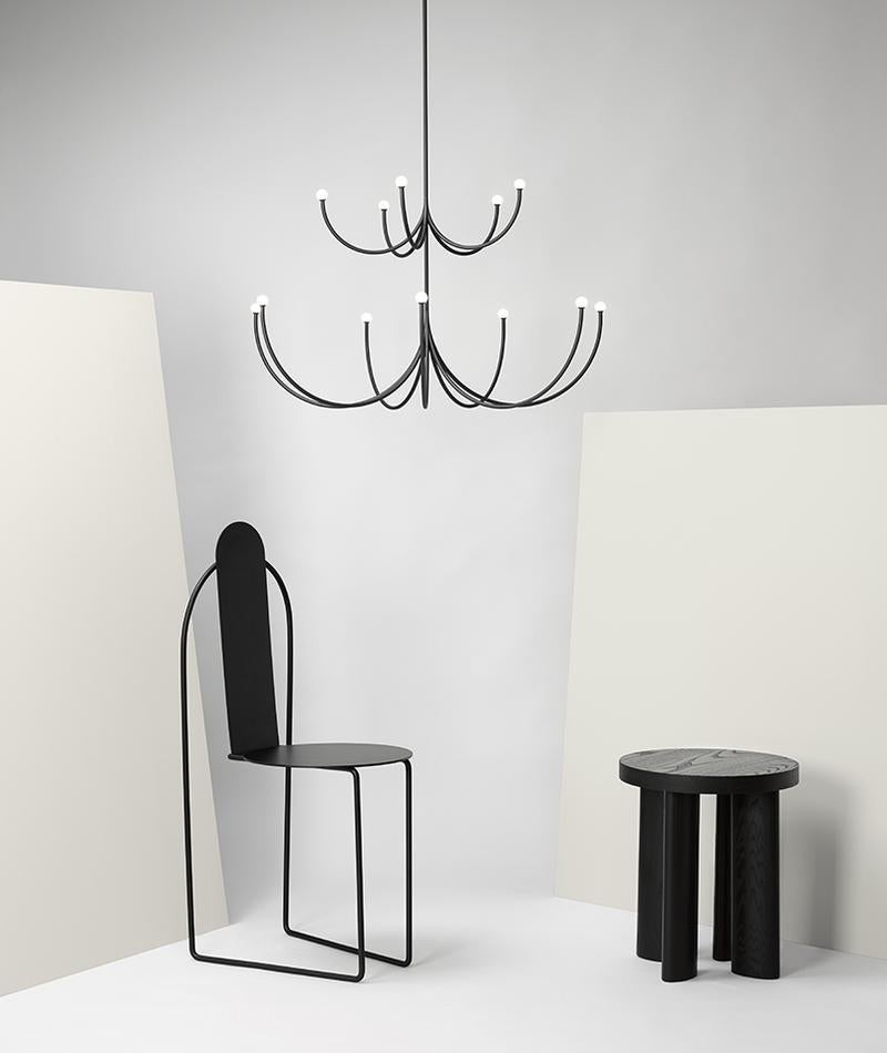 Arca is a lighting system whose form is a play of contrasts between the classical swooping branches and the spare minimalism of its linear, black composition. Tiers can be easily added together to create a unique chandelier. LED/CRI 90