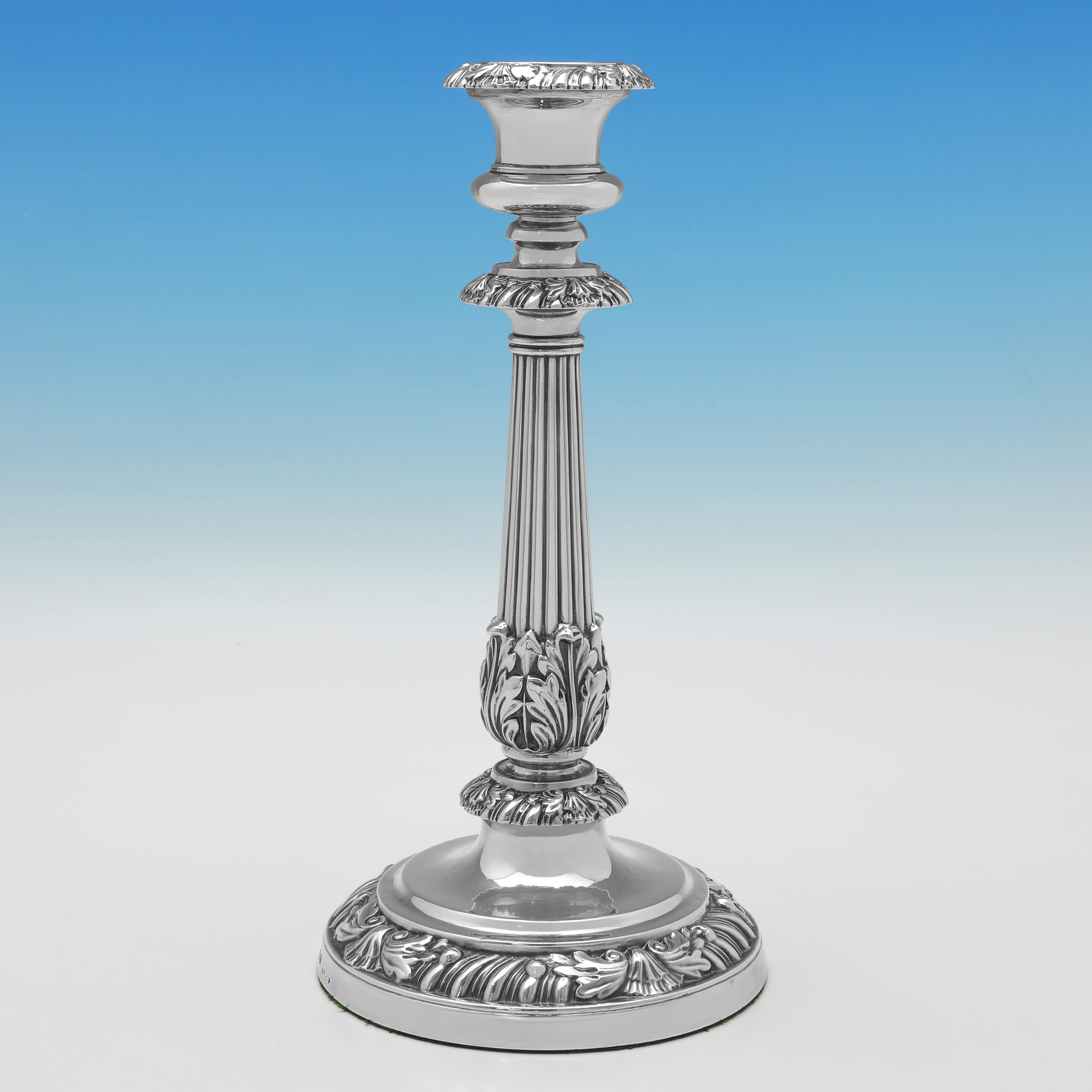 Hallmarked in Birmingham in 1821 by Matthew Boulton, this stunning pair of George IV period, Antique Sterling Silver Candlesticks, feature gadroon, shell and acanthus borders, acanthus detailing to the fluted columns, and removable nozzles. 

Each